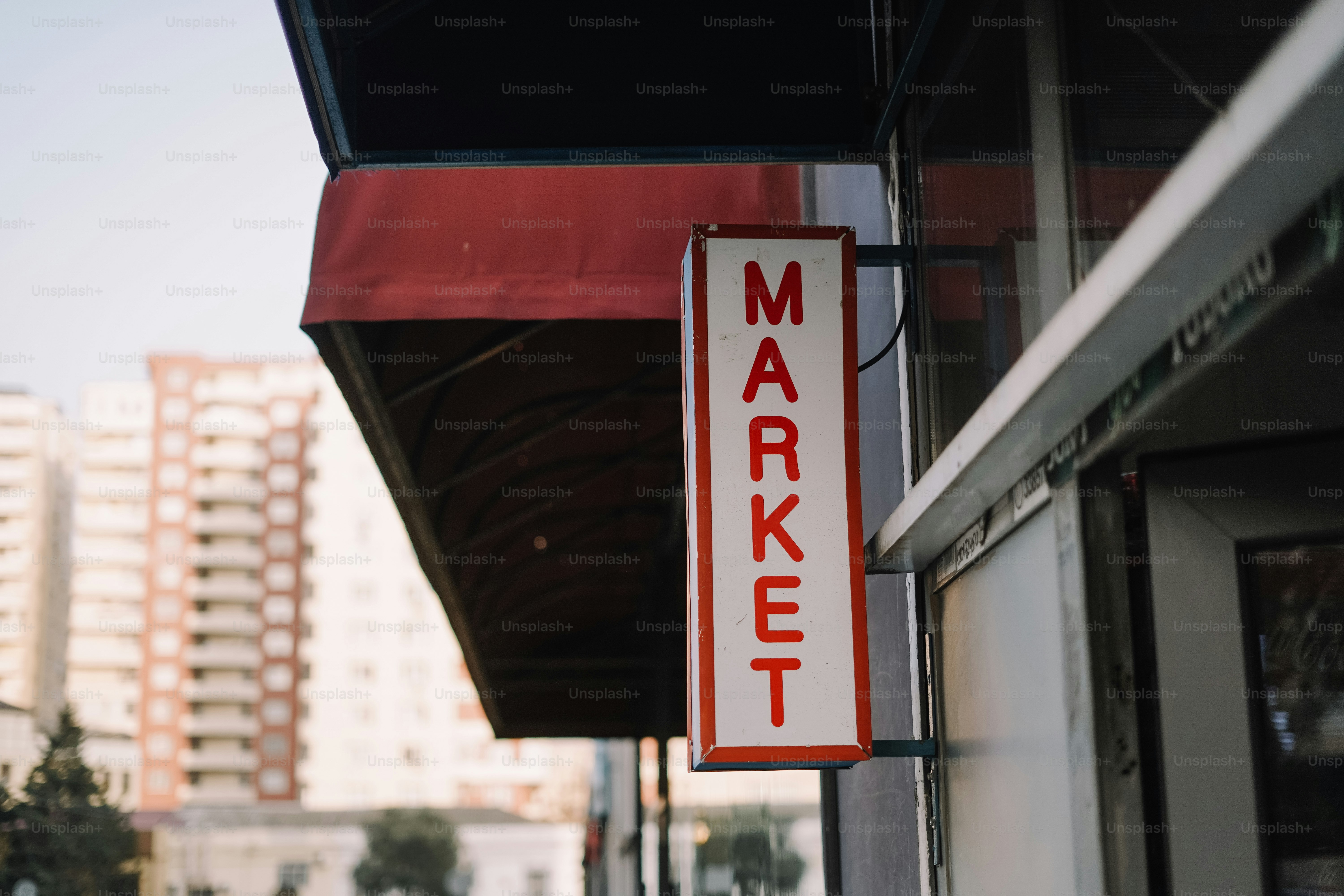 Red and white sign reads market