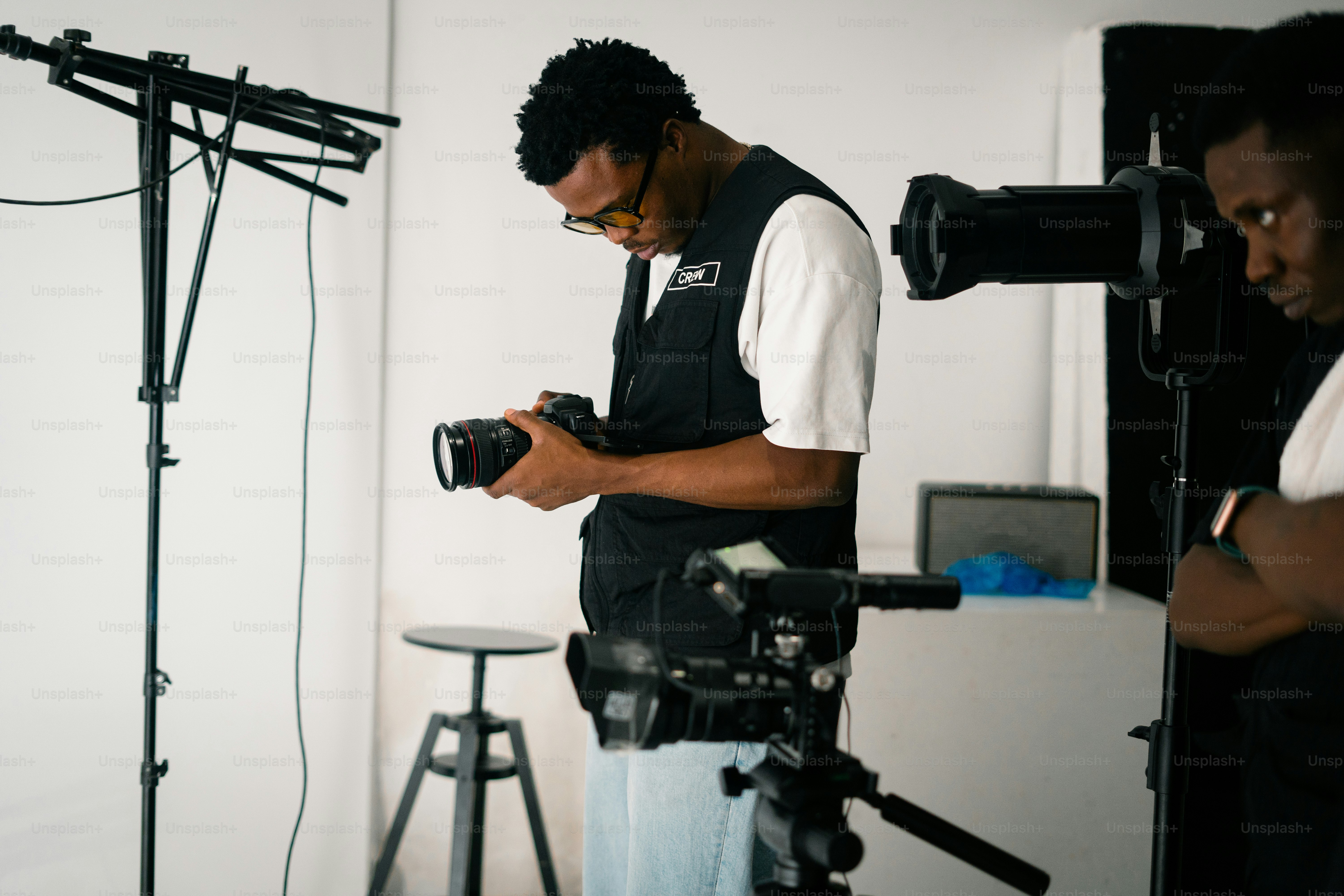 Two men in a studio with camera equipment