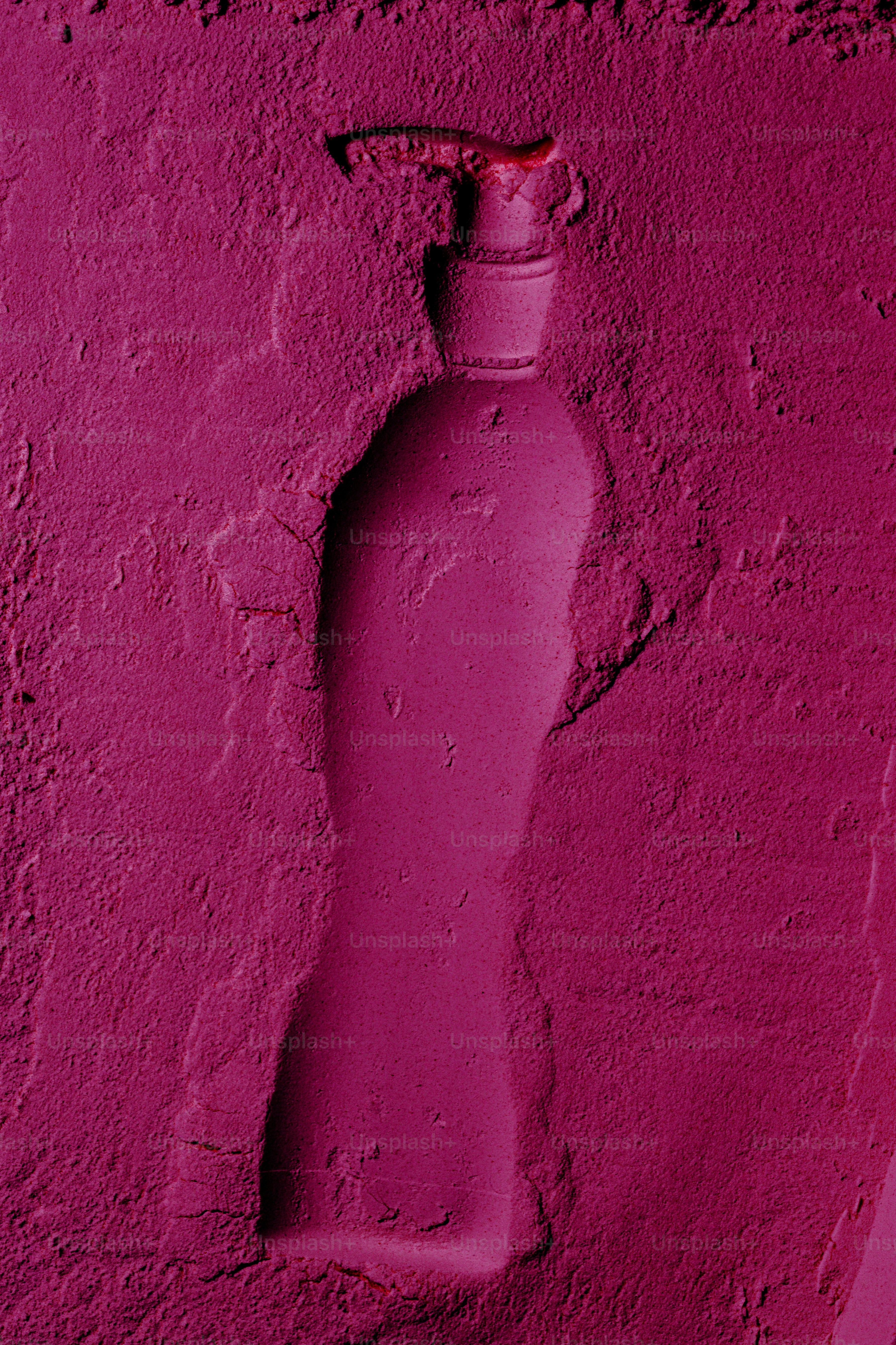 A bottle shape pressed into pink powder photo – Minimalist Image on ...