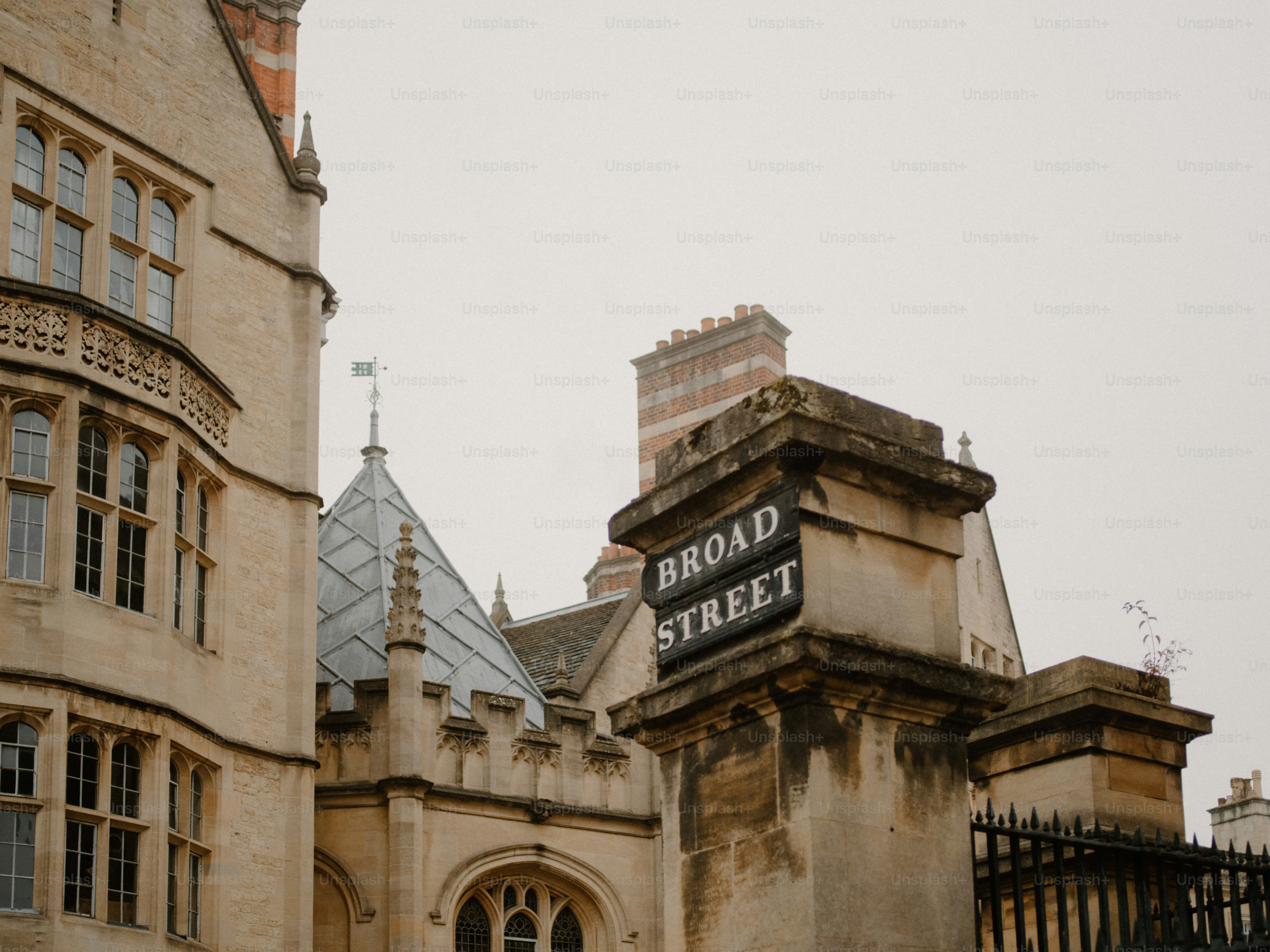 Ornate gothic windows on a stone building facade photo – Architecture ...