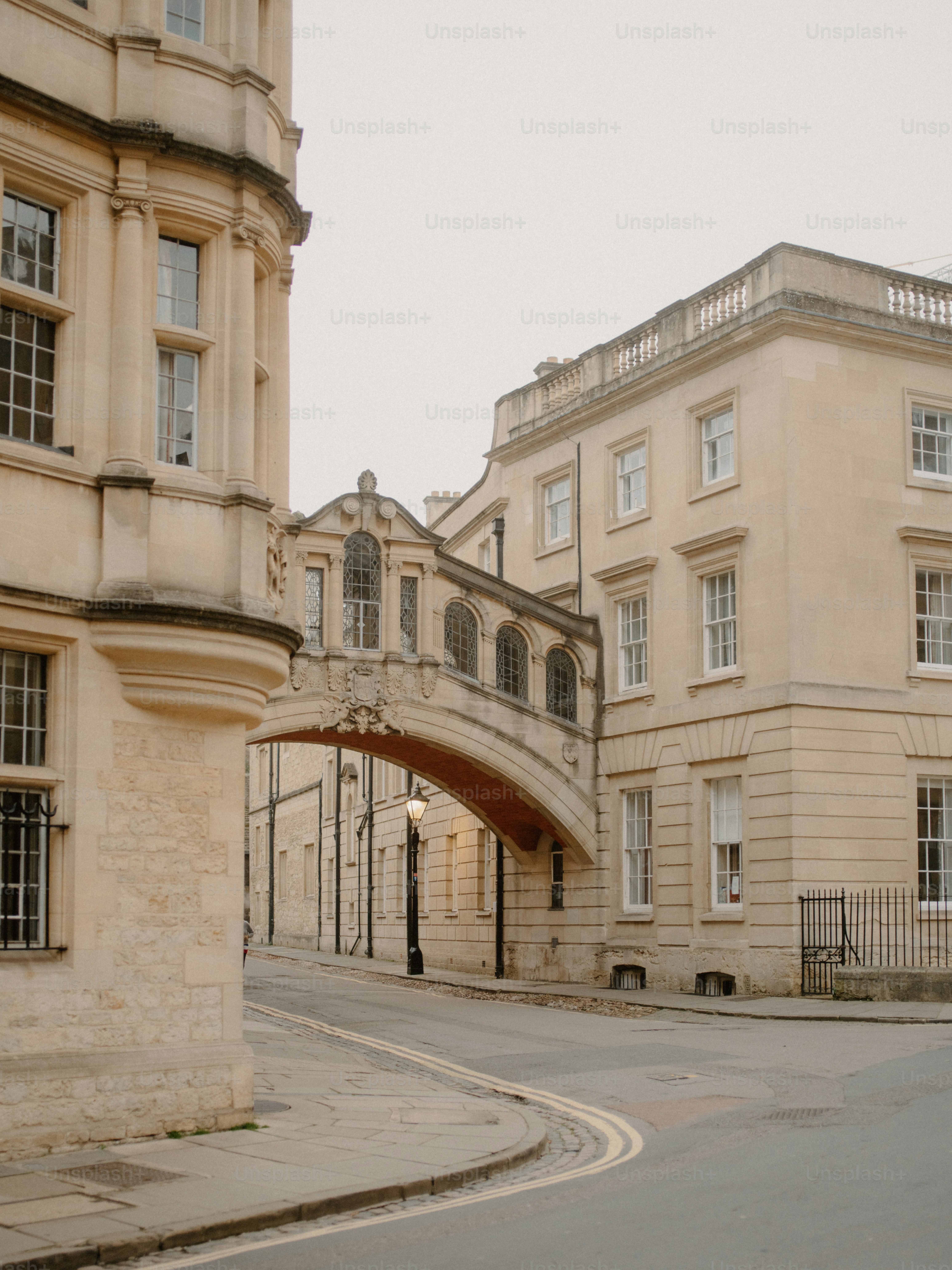 Historic bridge connecting two stone buildings over street
