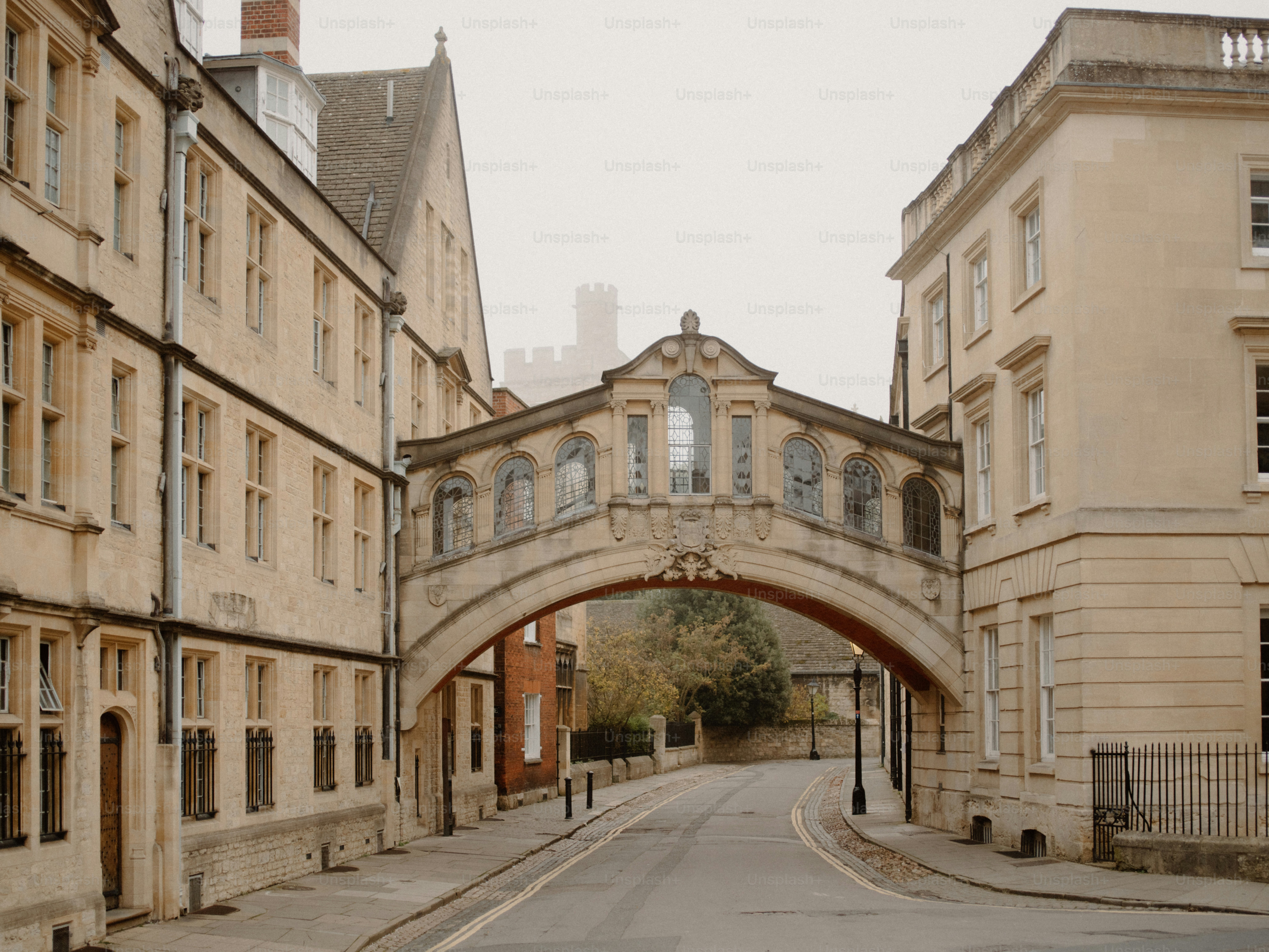 Historic bridge connecting buildings over a street.