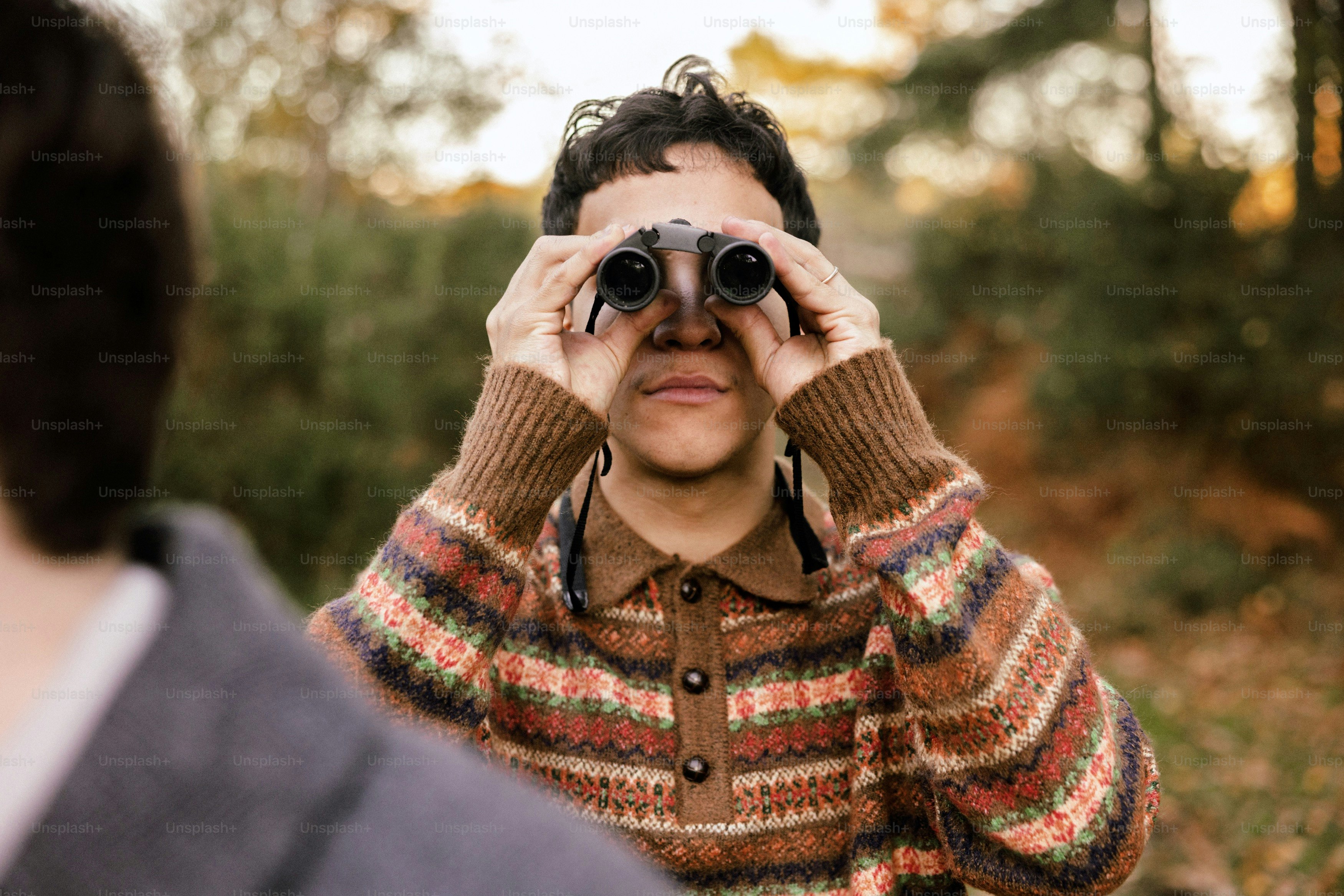 Man looking through binoculars in a forest photo – Forest Image on Unsplash