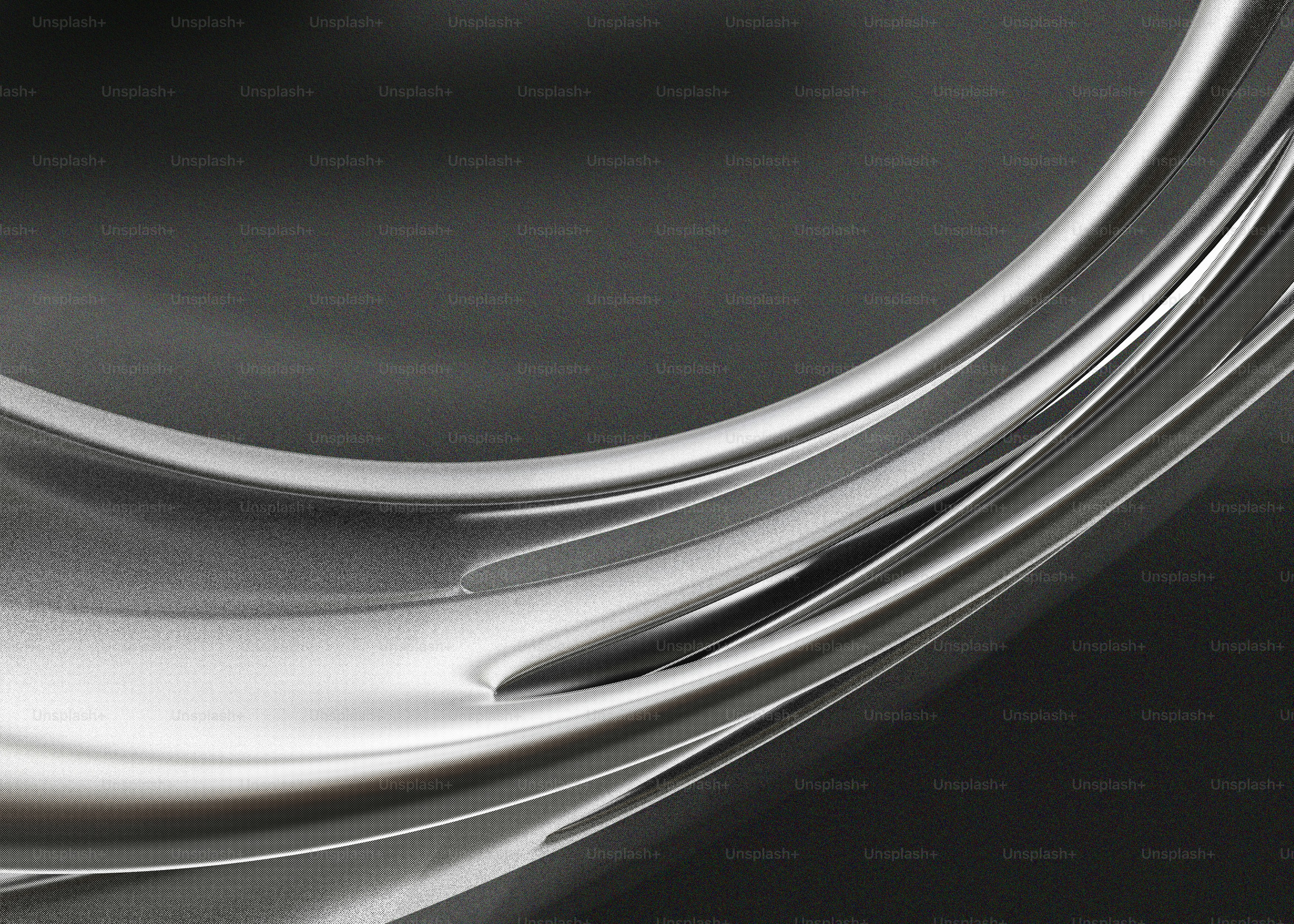Curve metalliche astratte su uno sfondo scuro