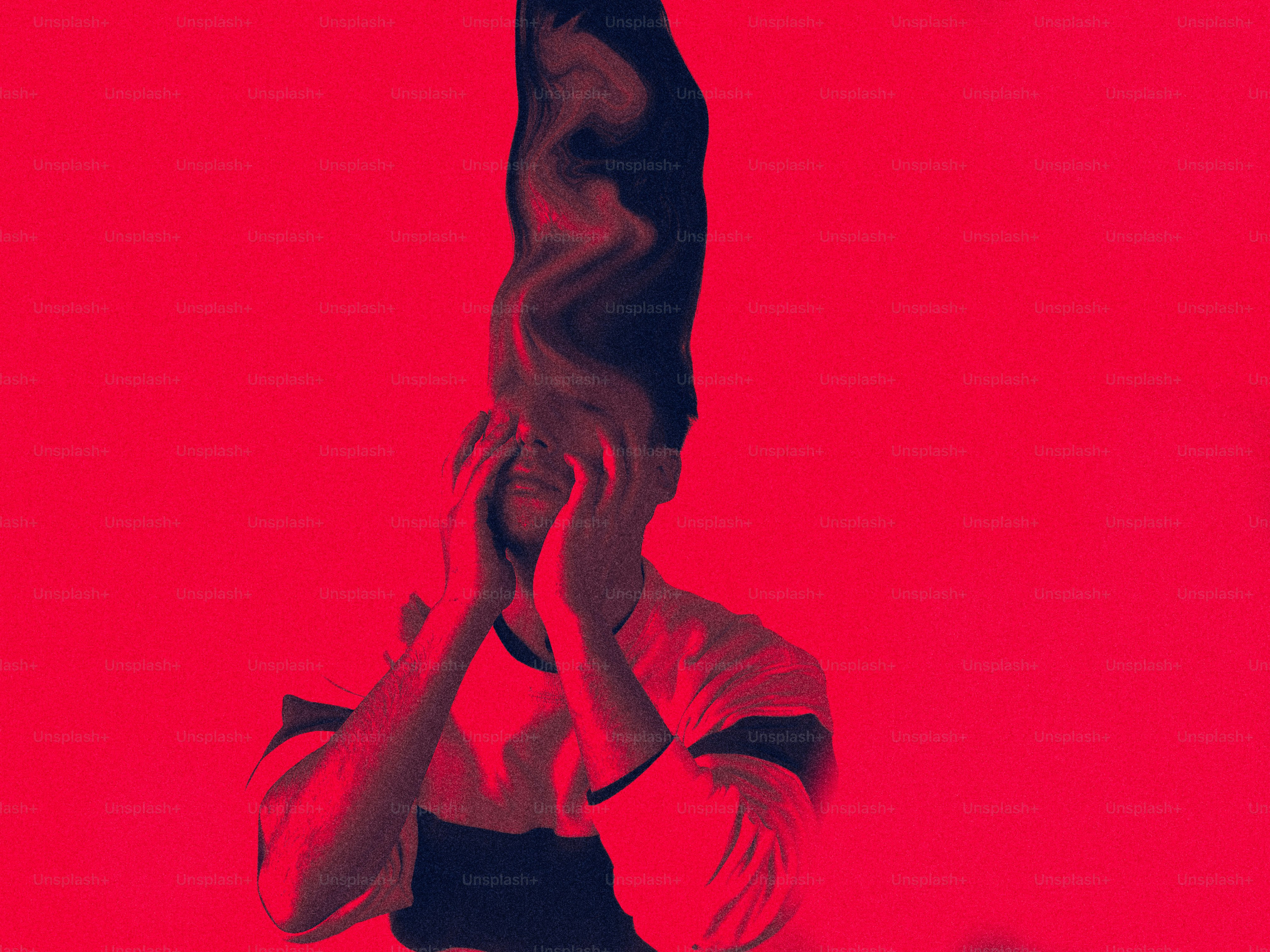 Distorted figure with hands over face on red background