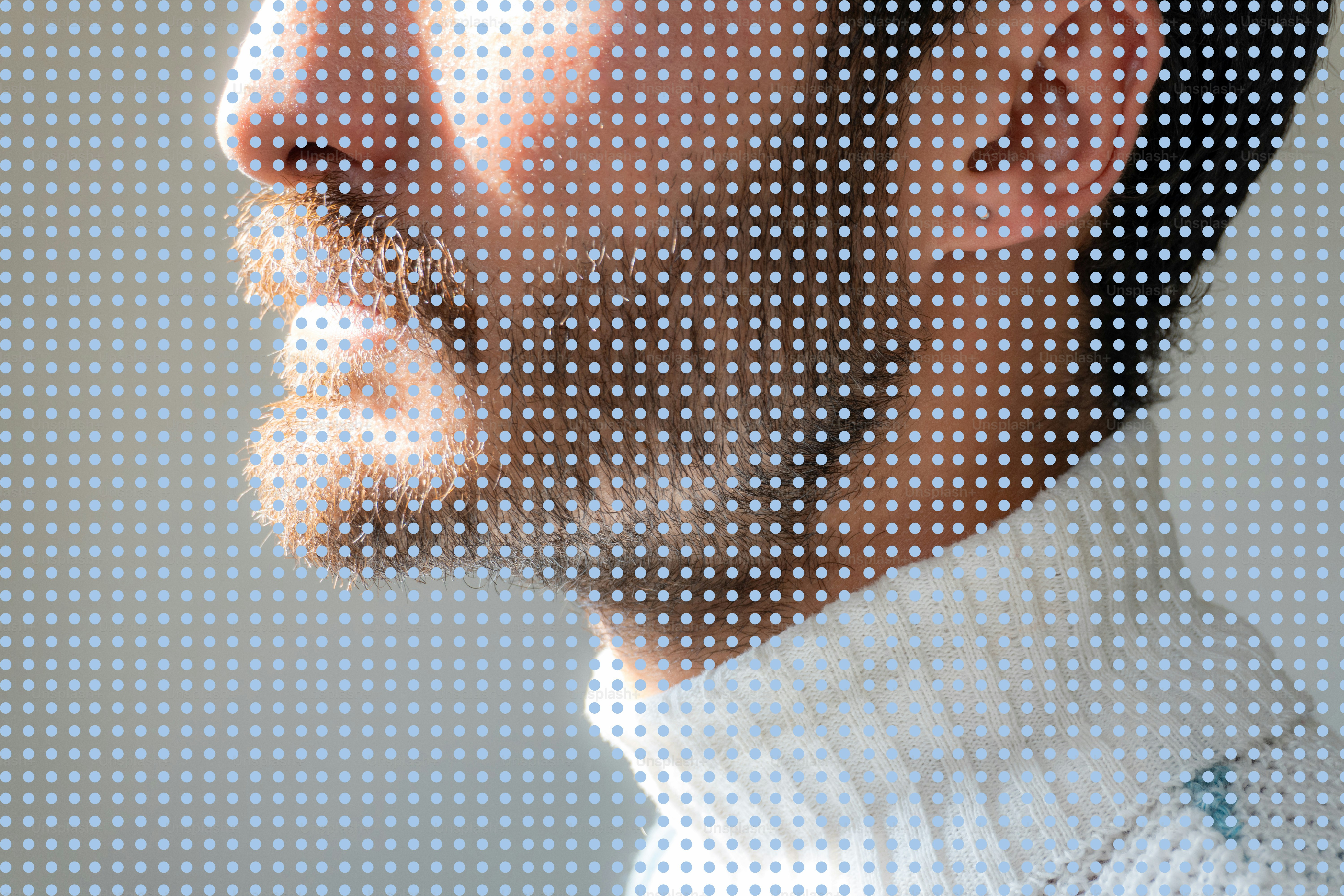 Man's profile with beard seen through dots