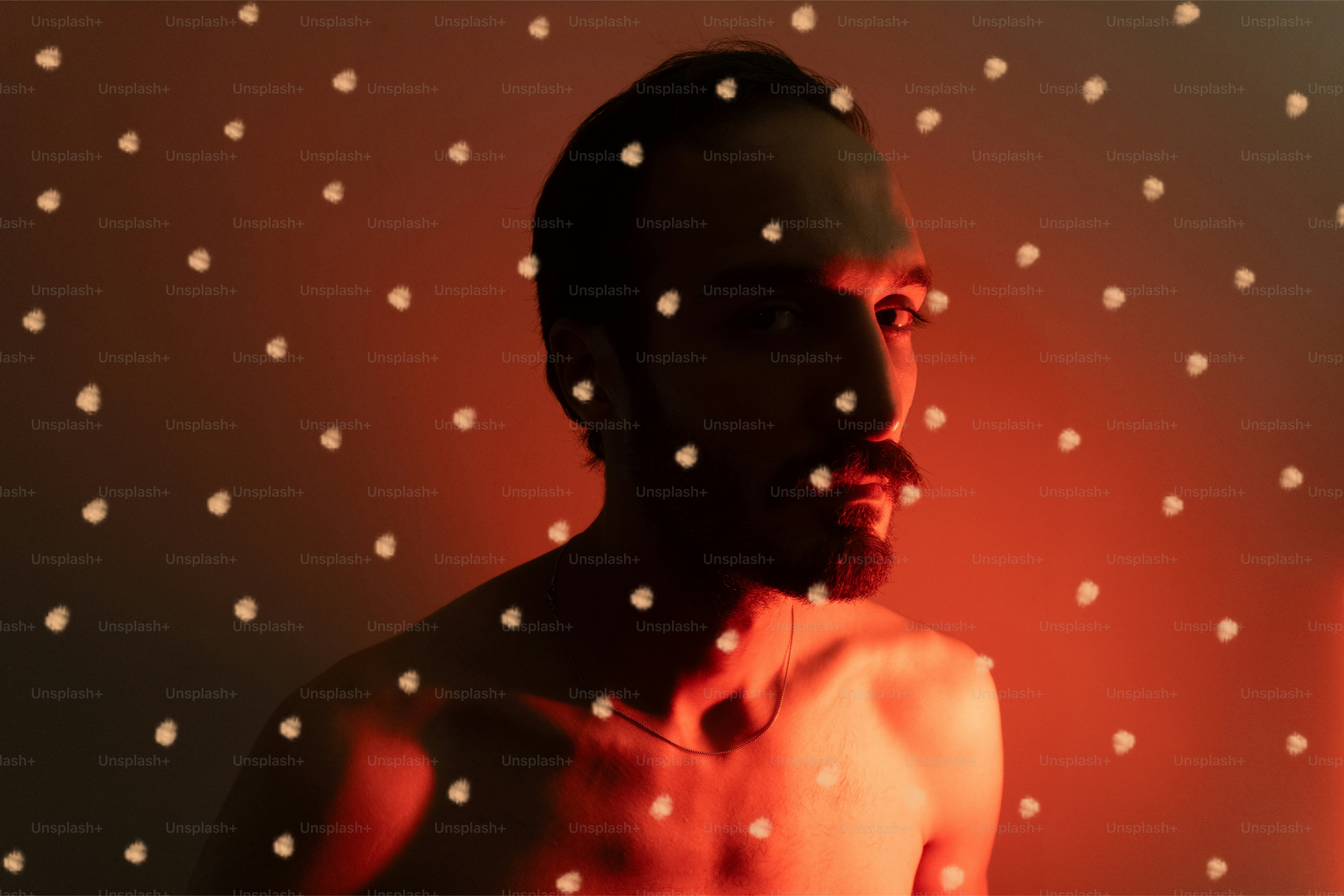 Man with light dots on his face
