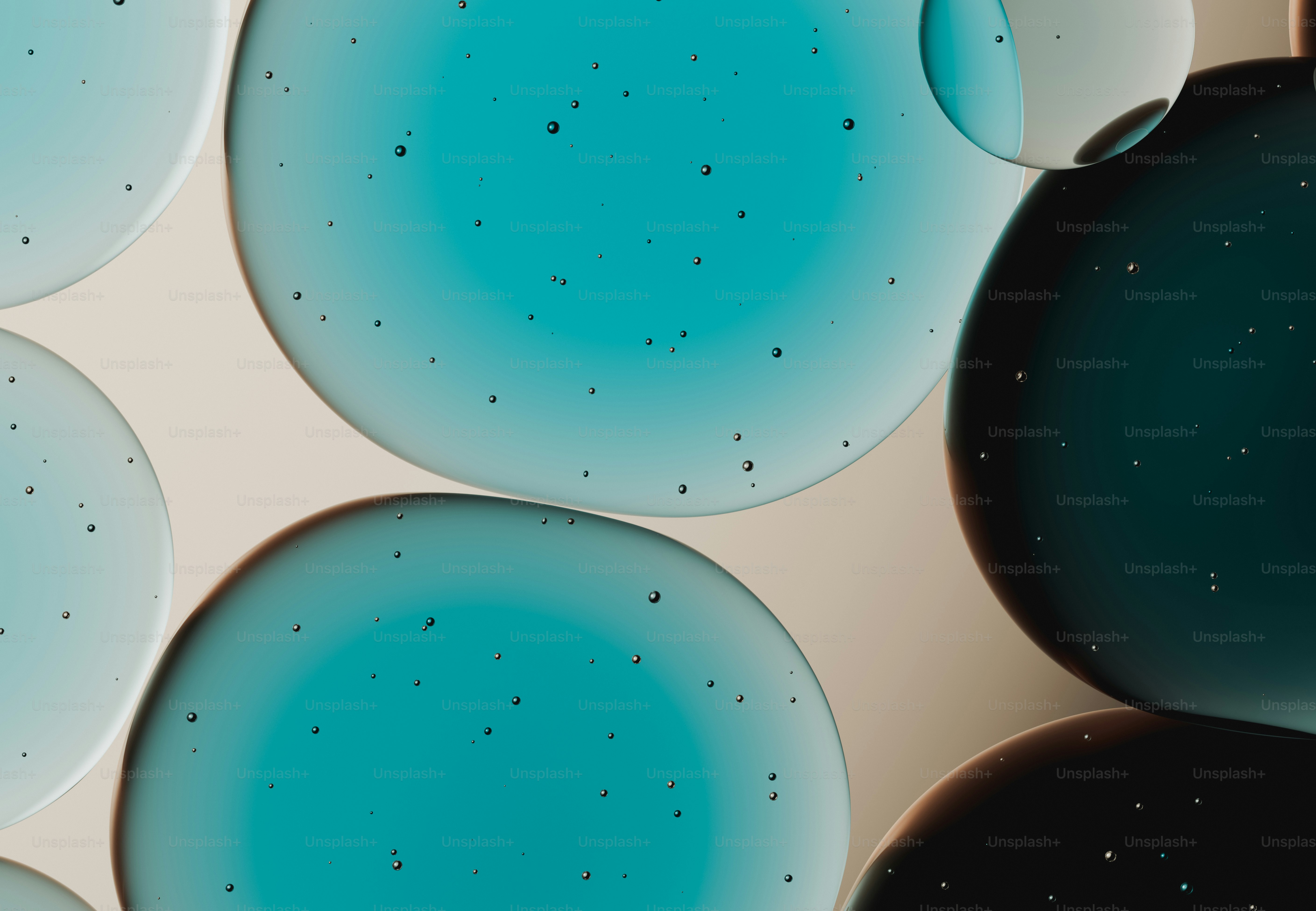 Abstract blue and teal circles with speckles.