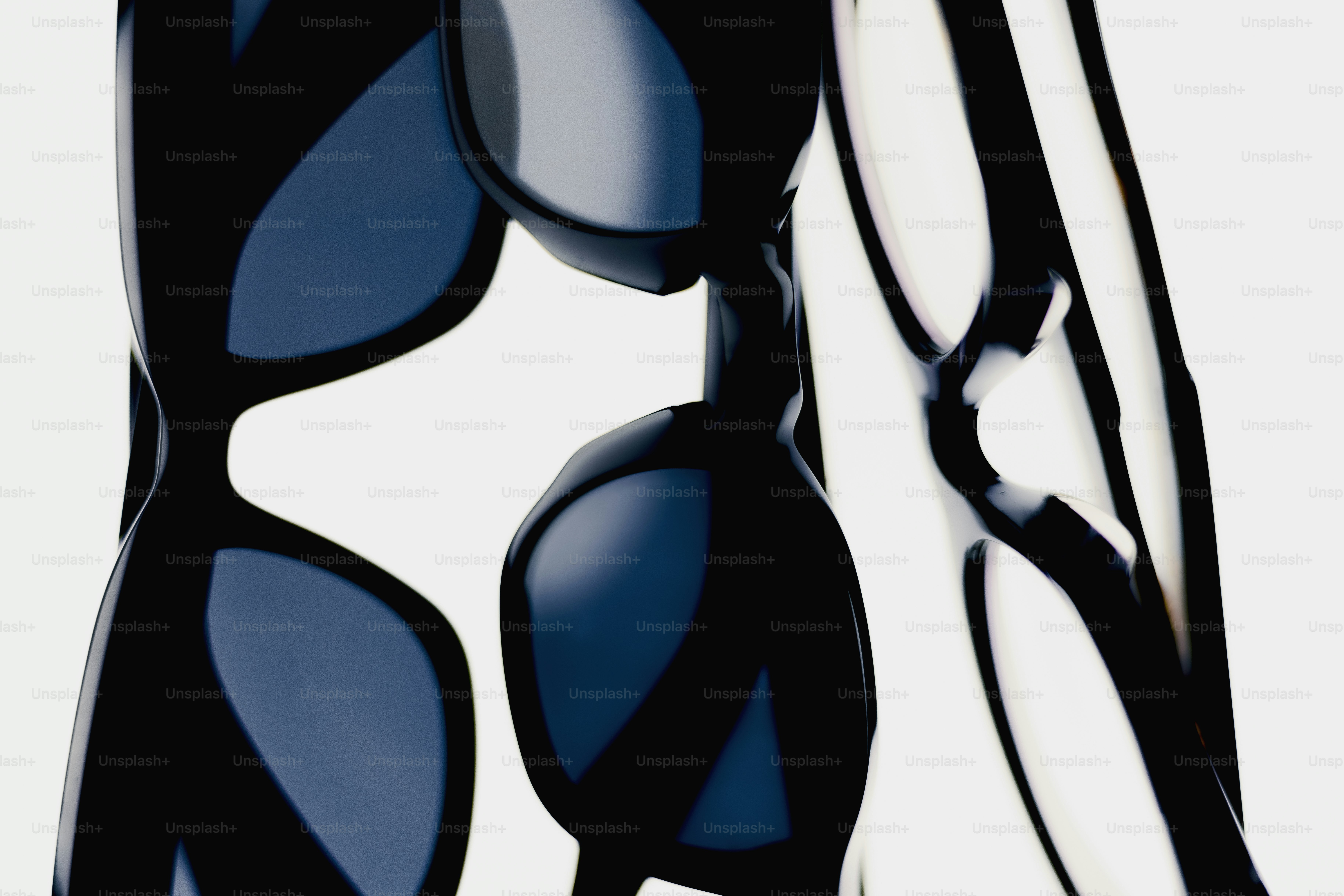 Black sunglasses with blue lenses on white background