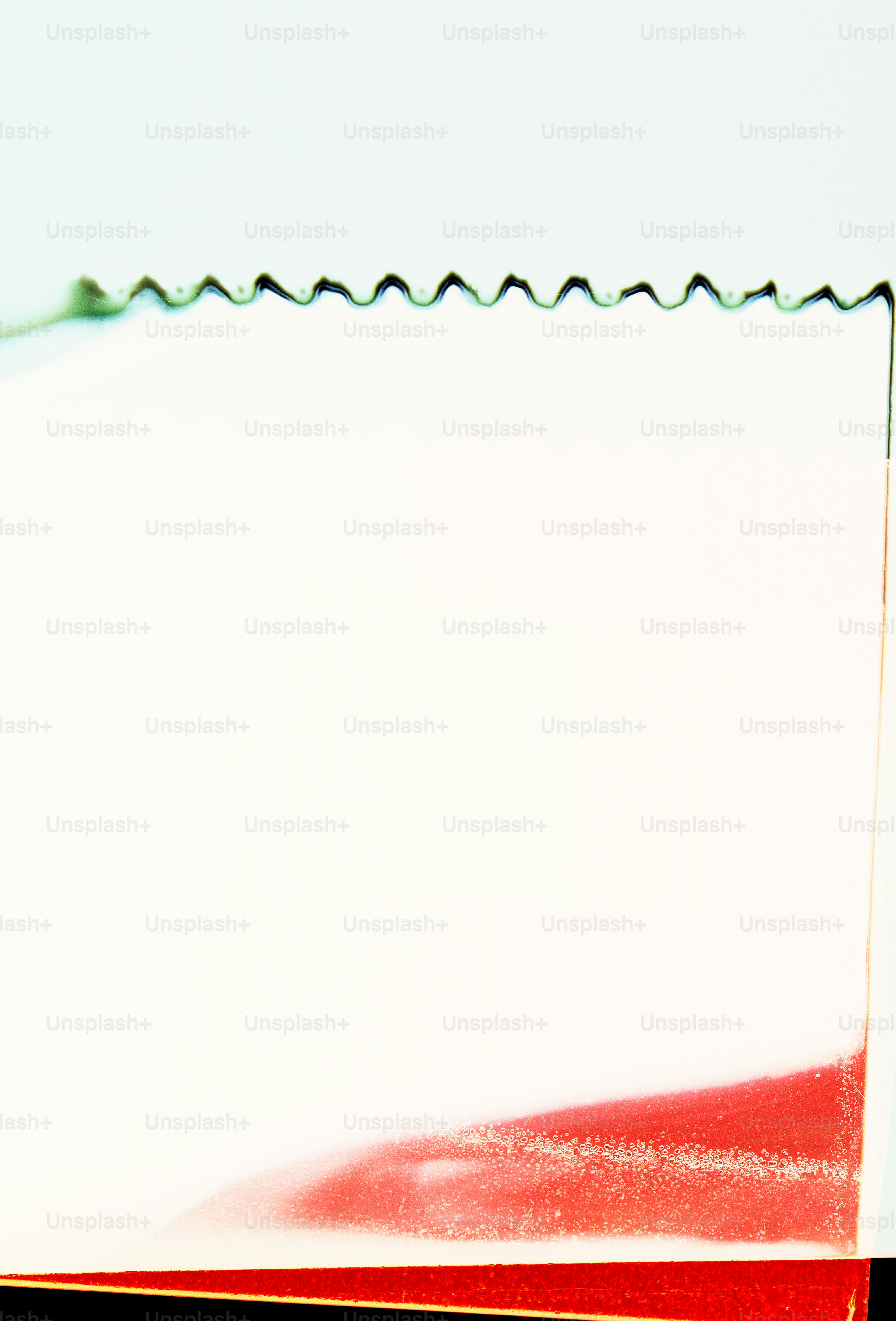 White paper with red abstract design