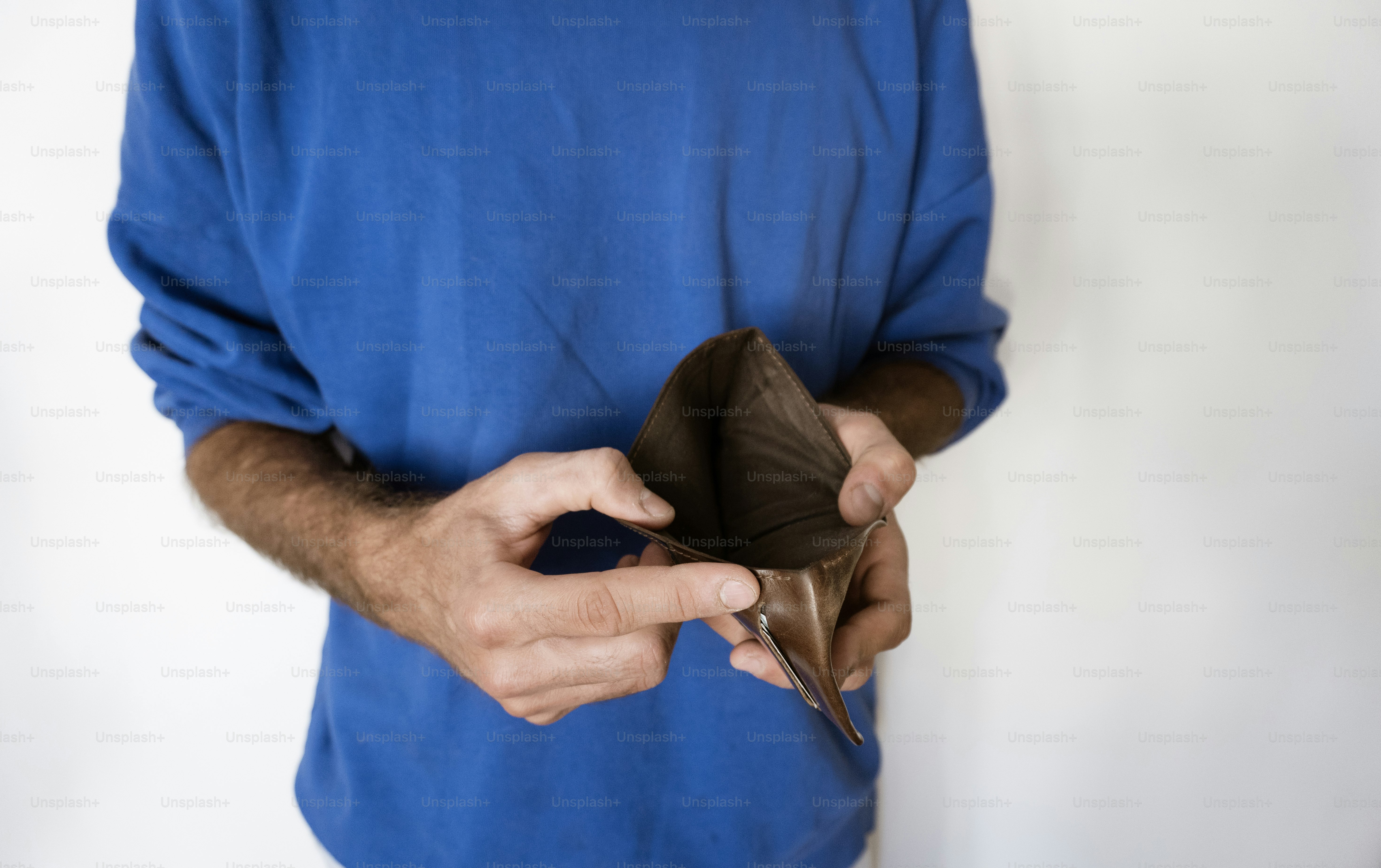 Person holding an empty wallet