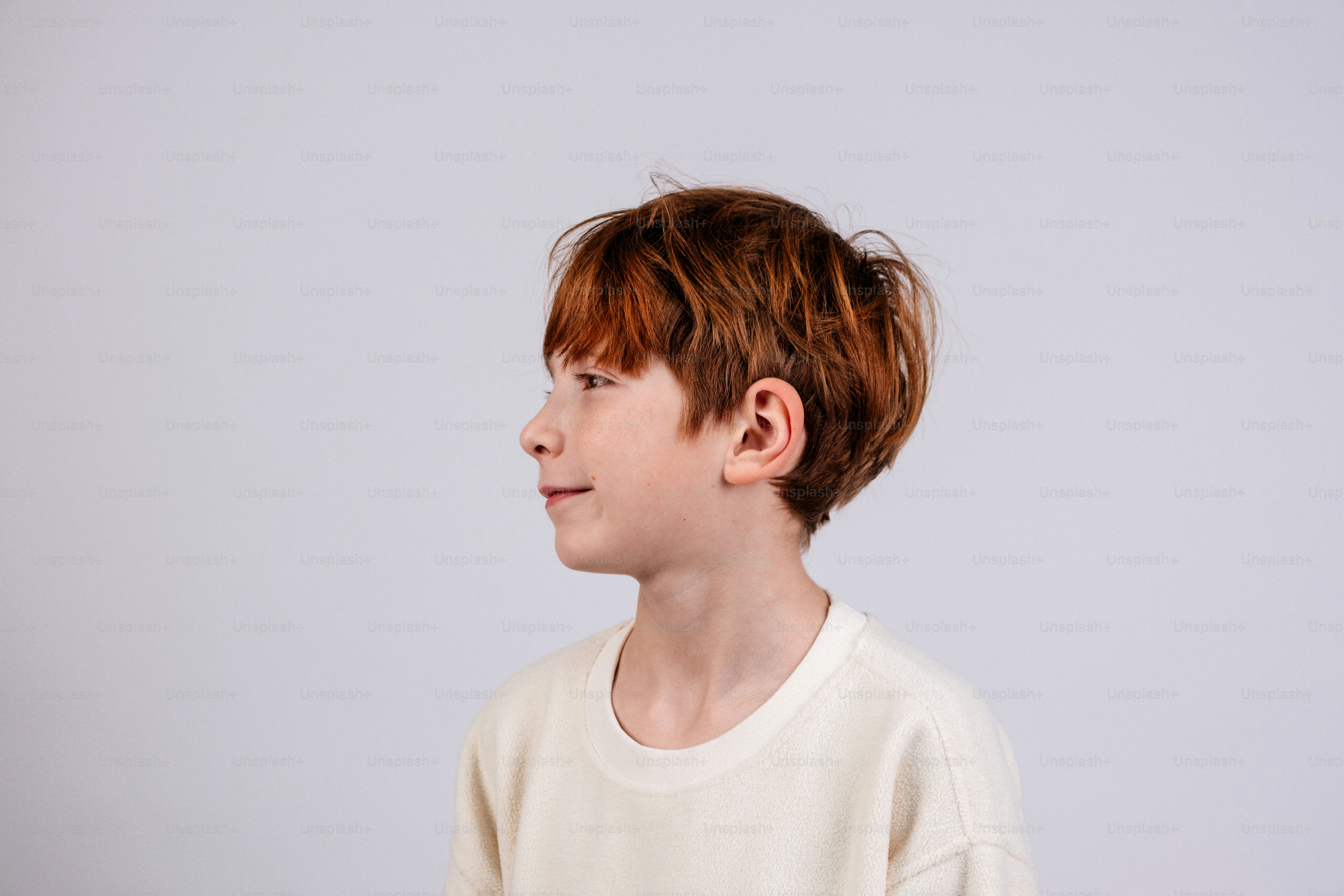 Young boy with red hair looking to the side. photo – Portrait Image on ...