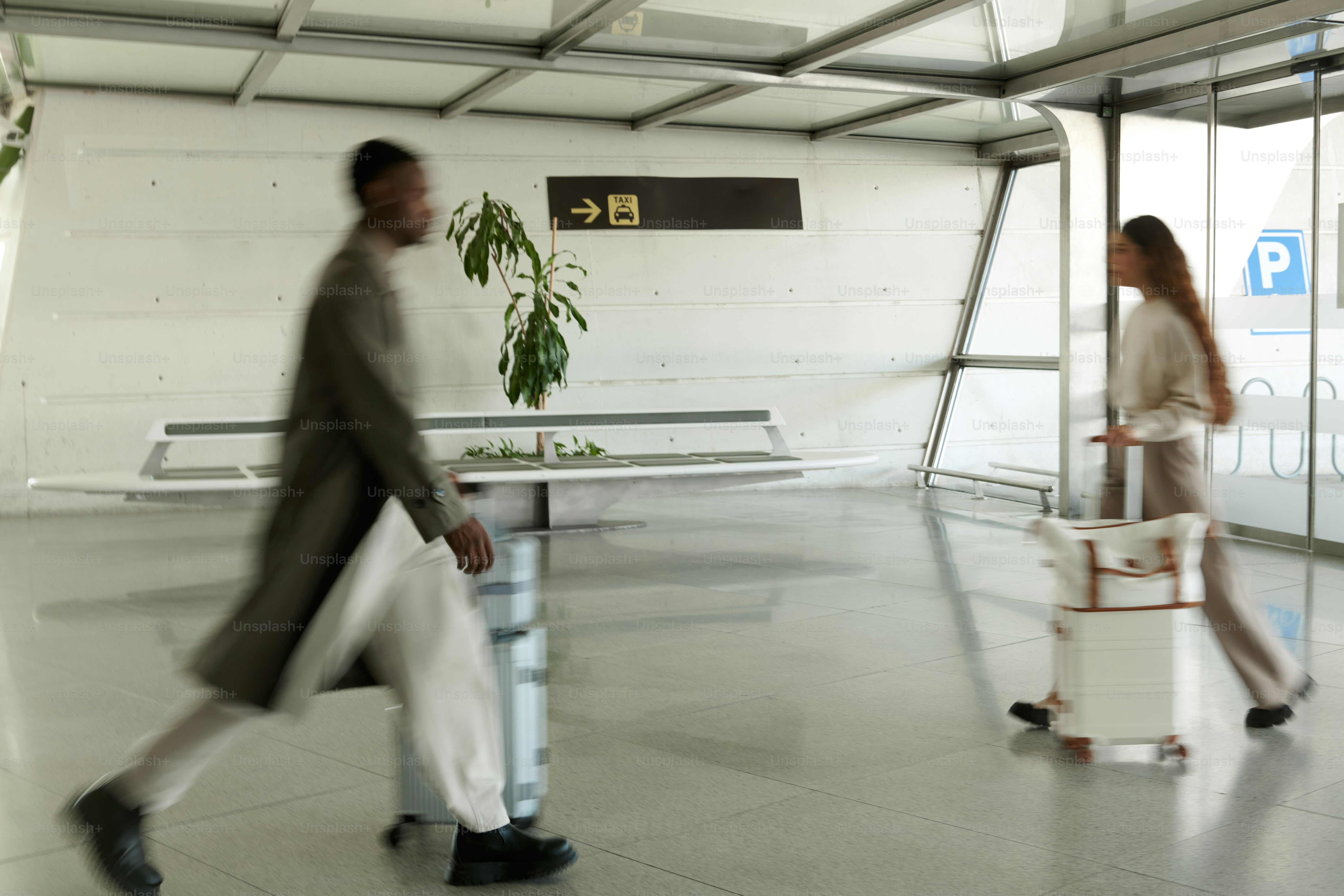 Man walking with luggage in modern airport terminal. photo – Travel ...