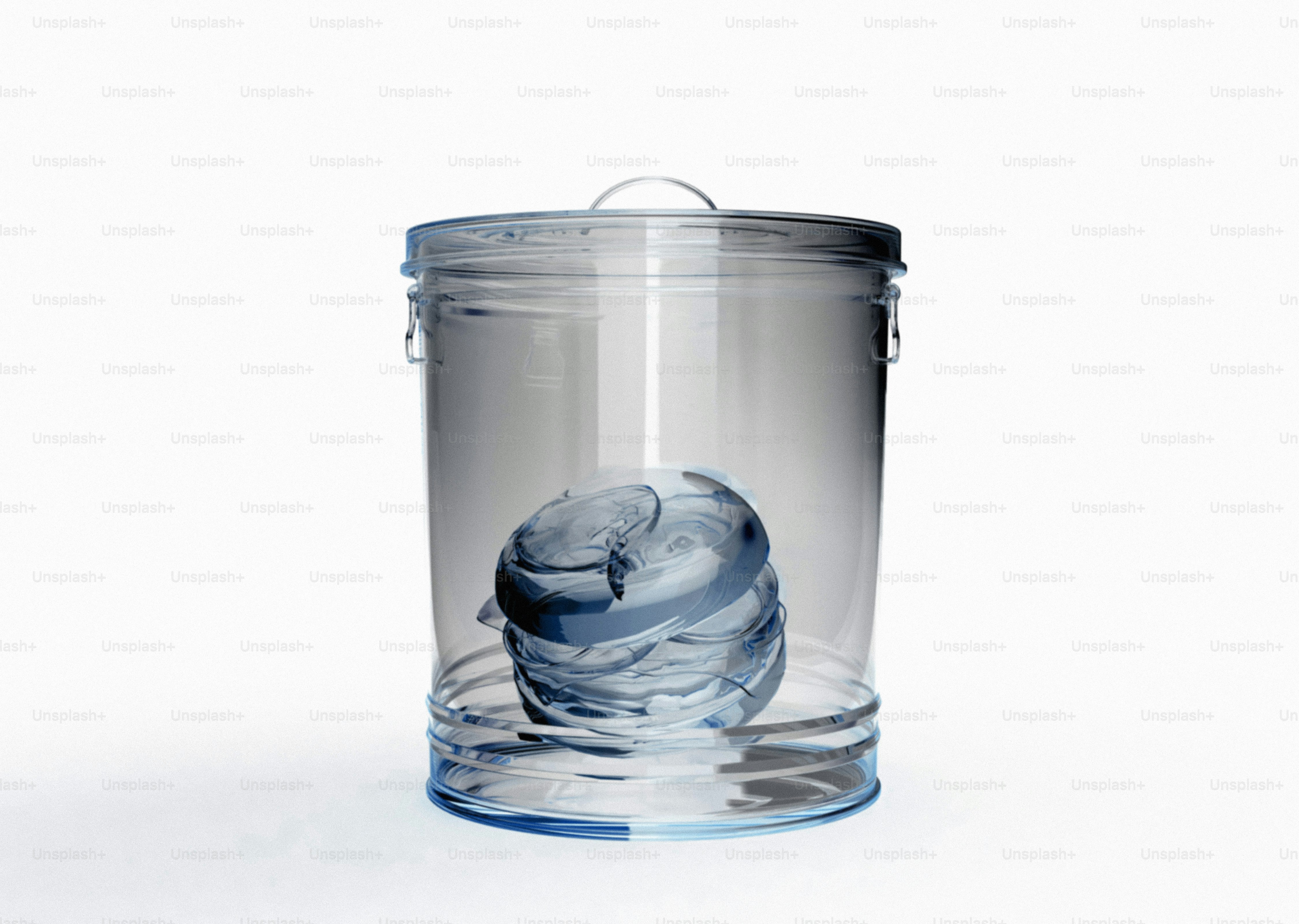 Transparent trash can with blue object inside