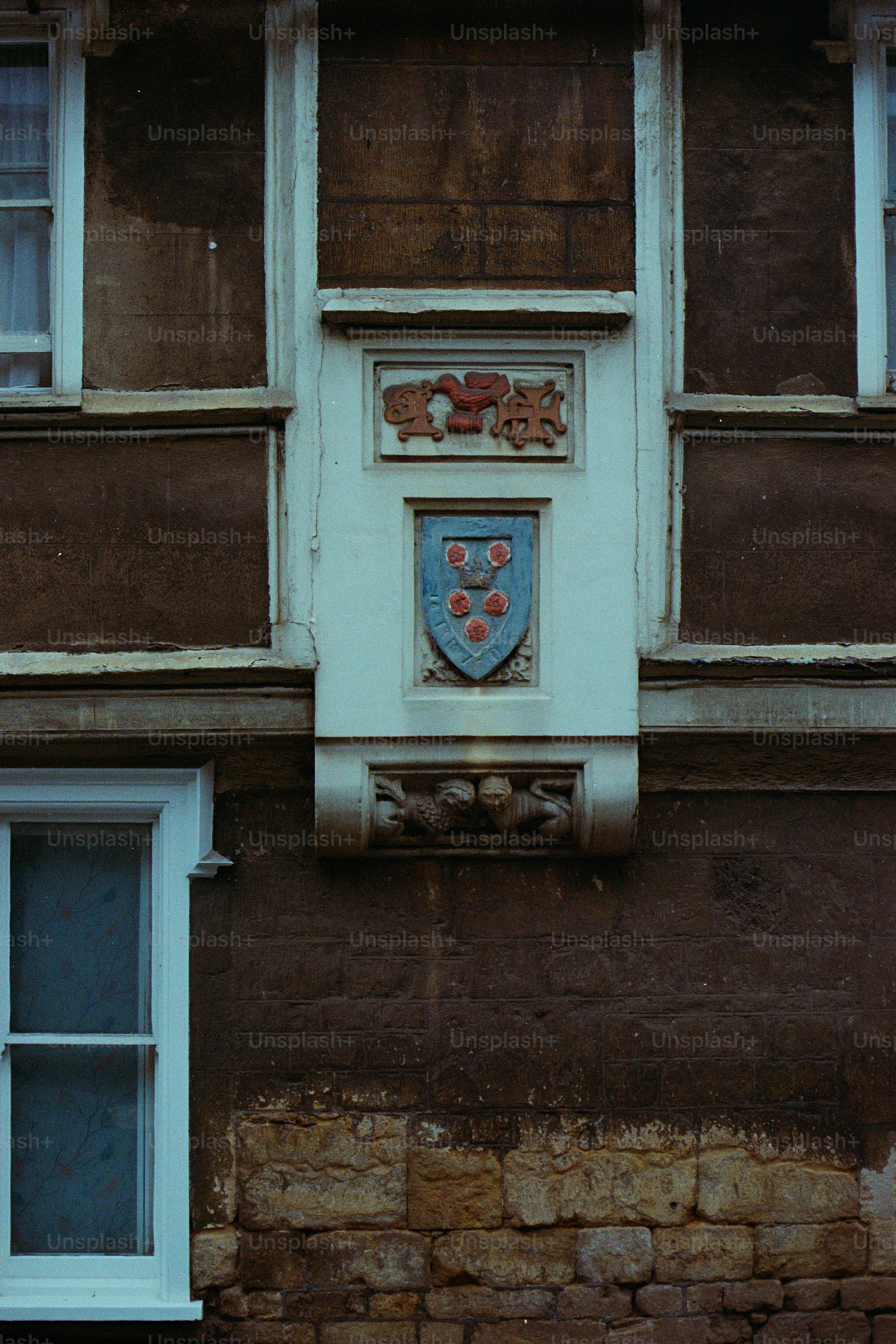 Stone building facade with decorative crest