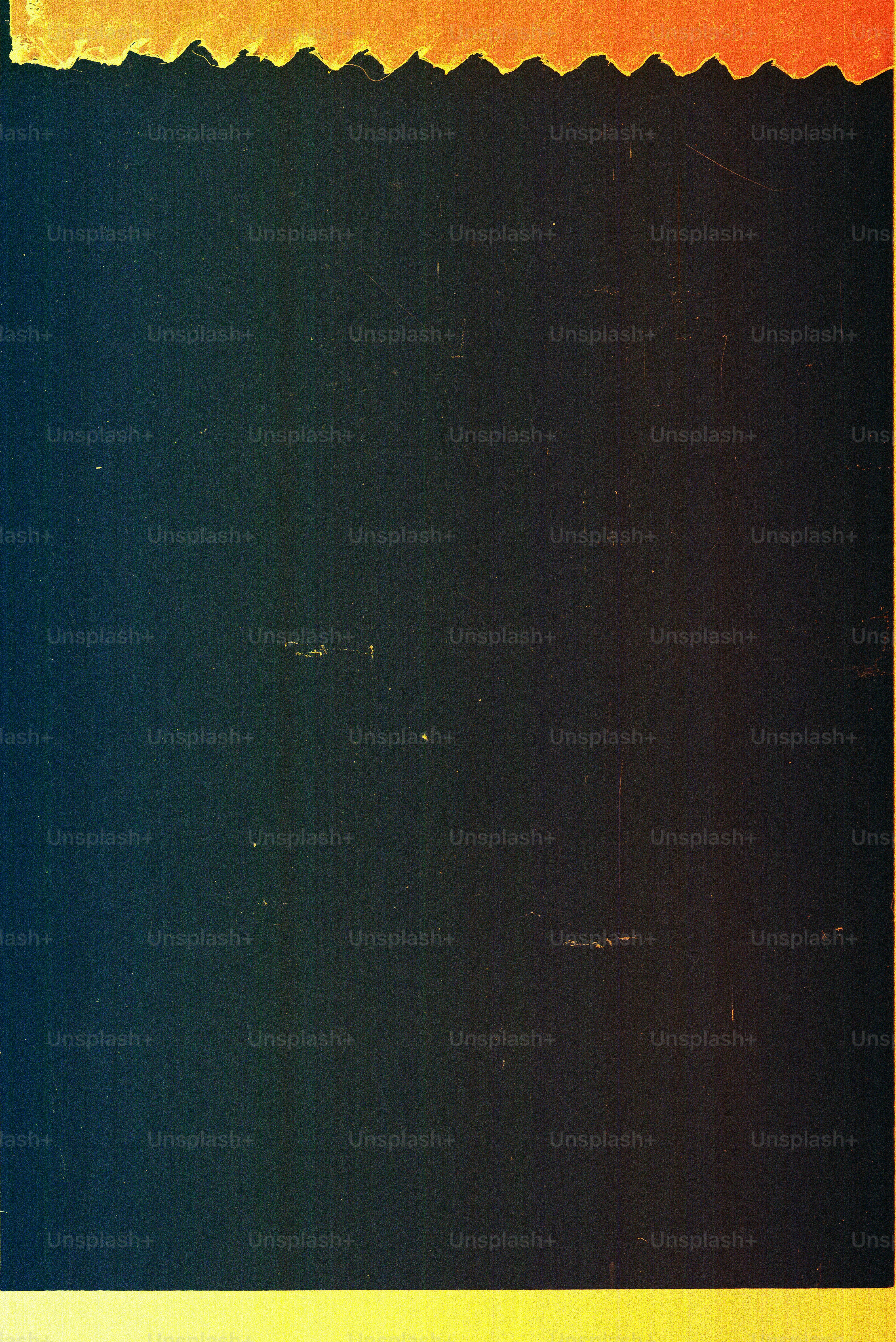 Orange serrated edge above dark textured background photo – England ...