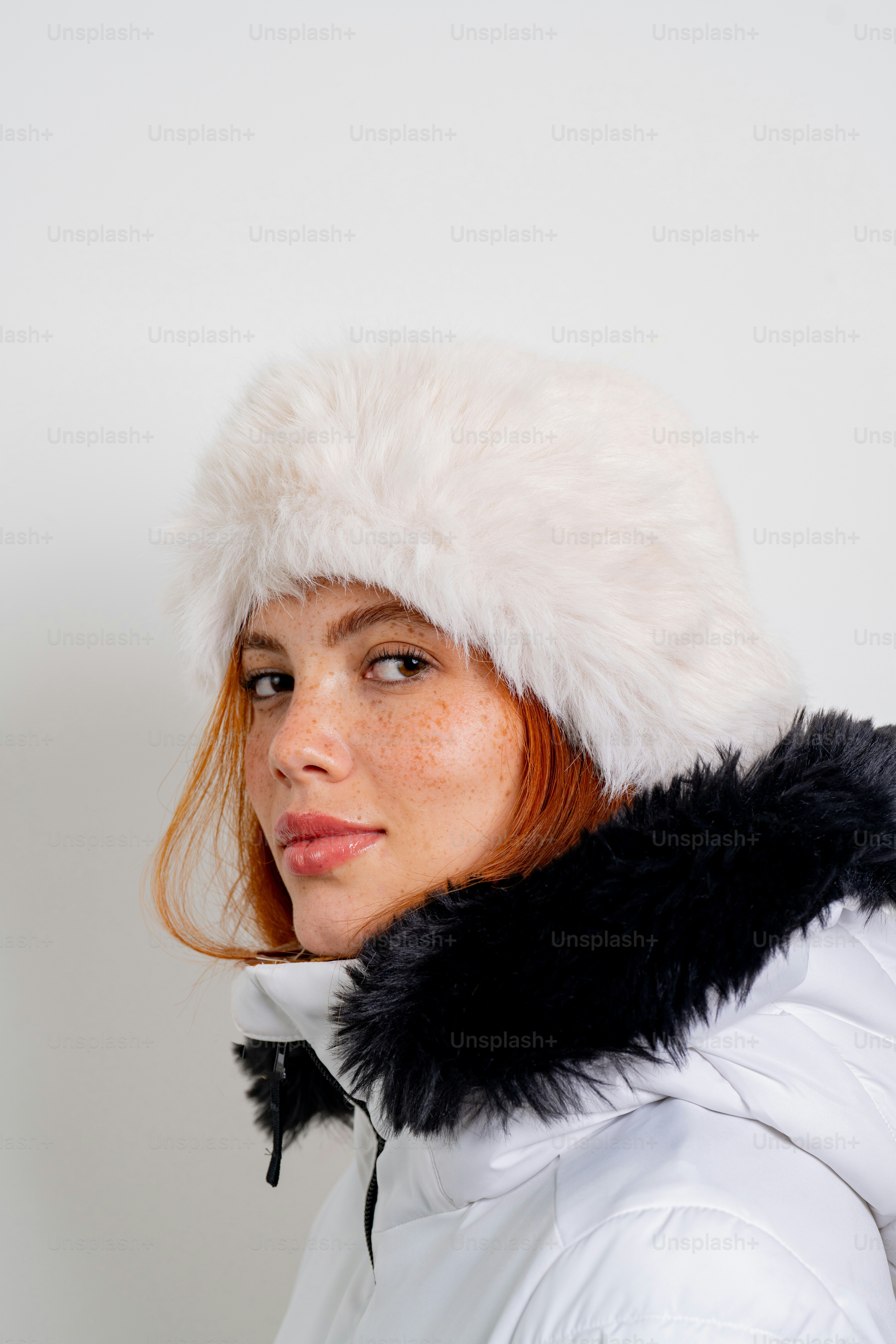 Woman with red hair wearing a white winter coat photo - Portrait Image ...