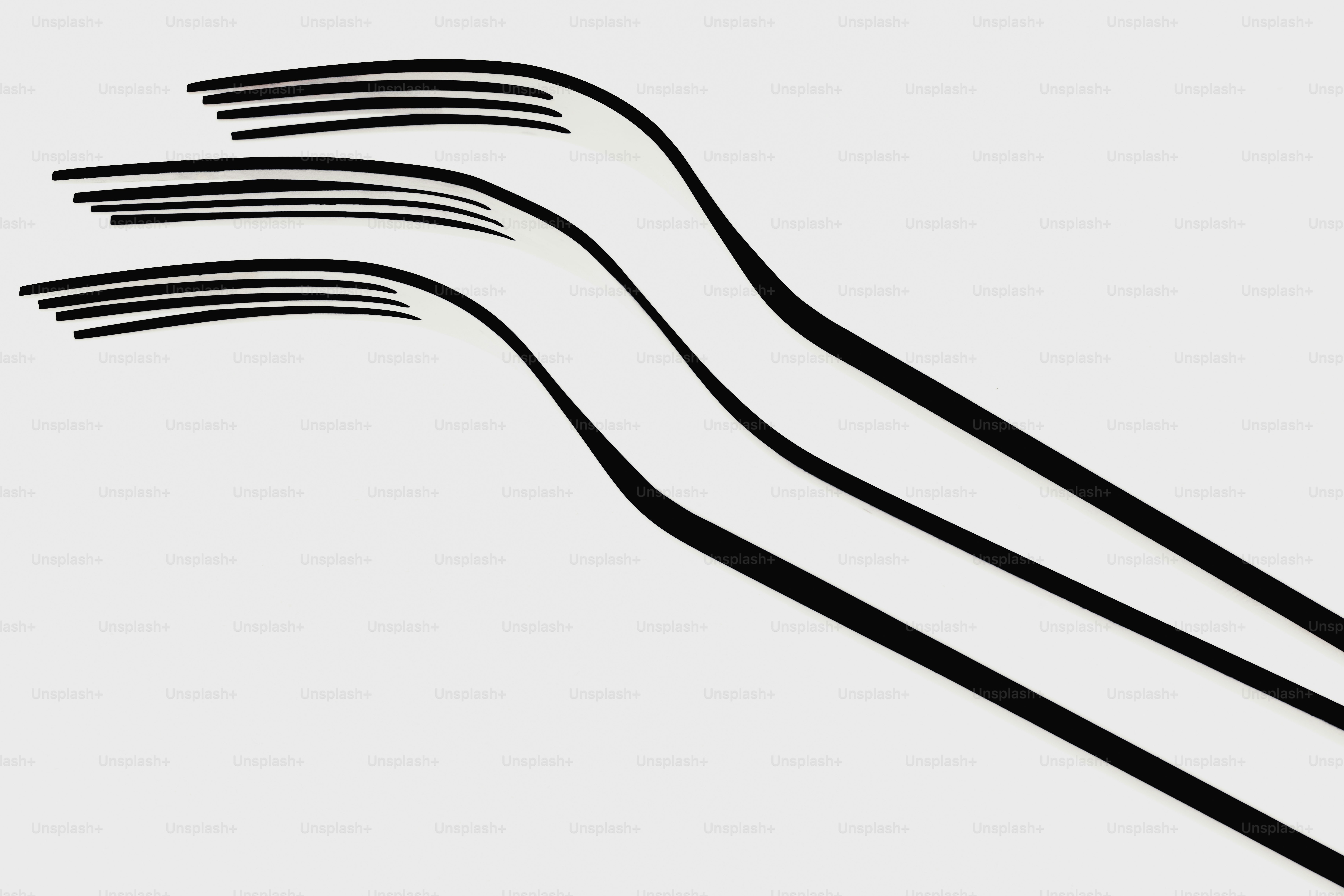 Three black forks on a light gray background