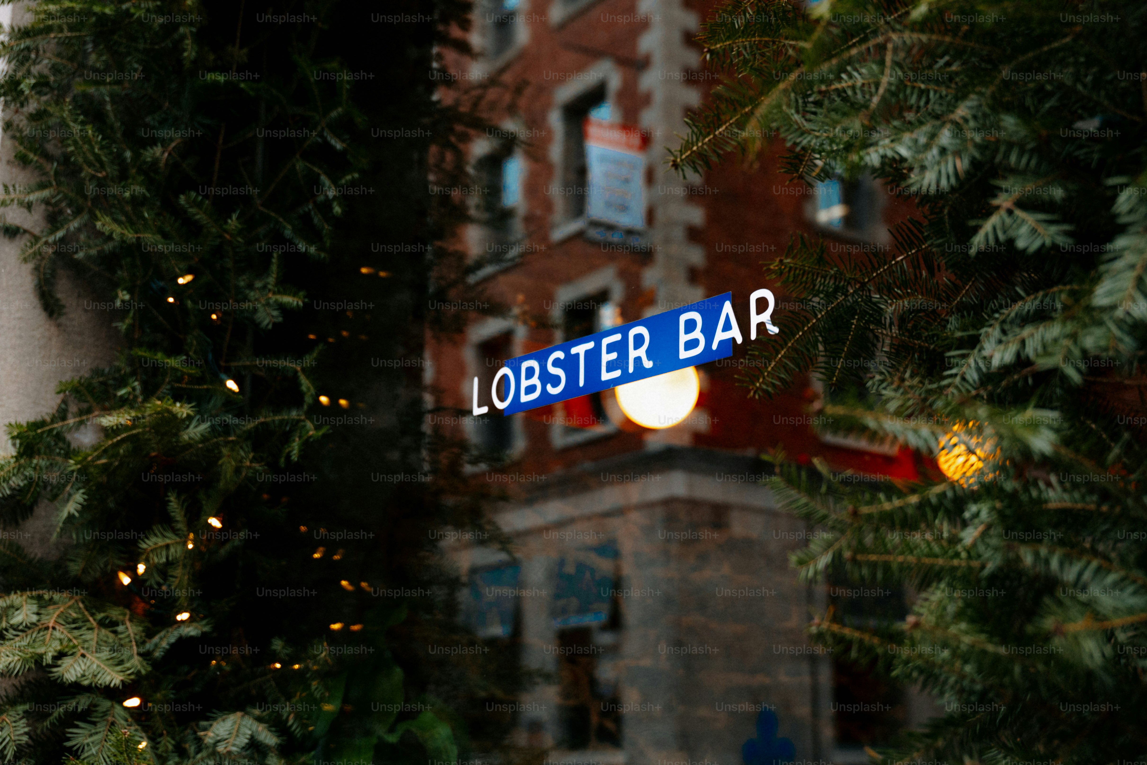 Lobster bar sign on brick building