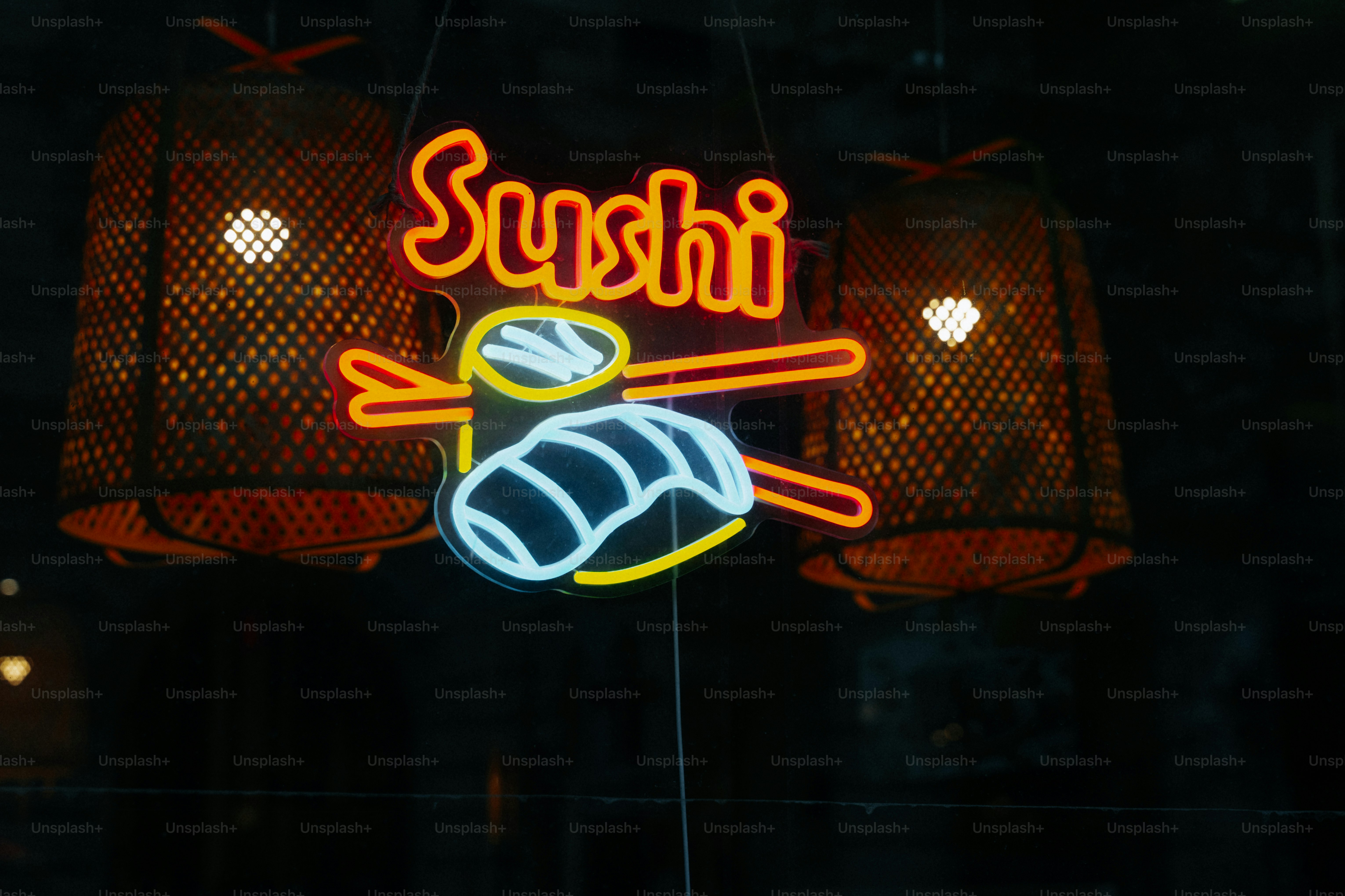 Neon sushi sign with chopsticks and bamboo lanterns