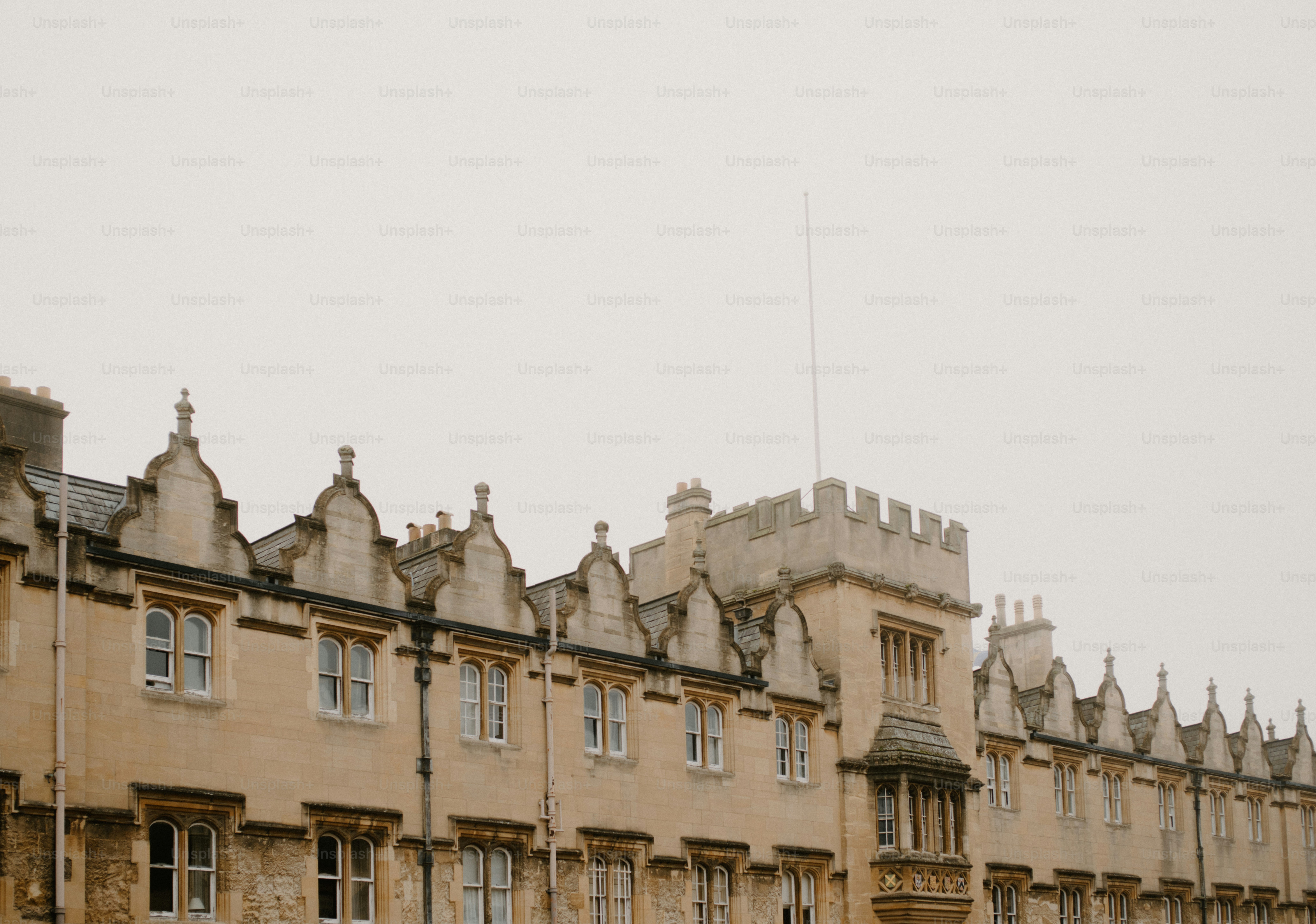 Ornate historic building facade under a cloudy sky photo – Oxford Image ...