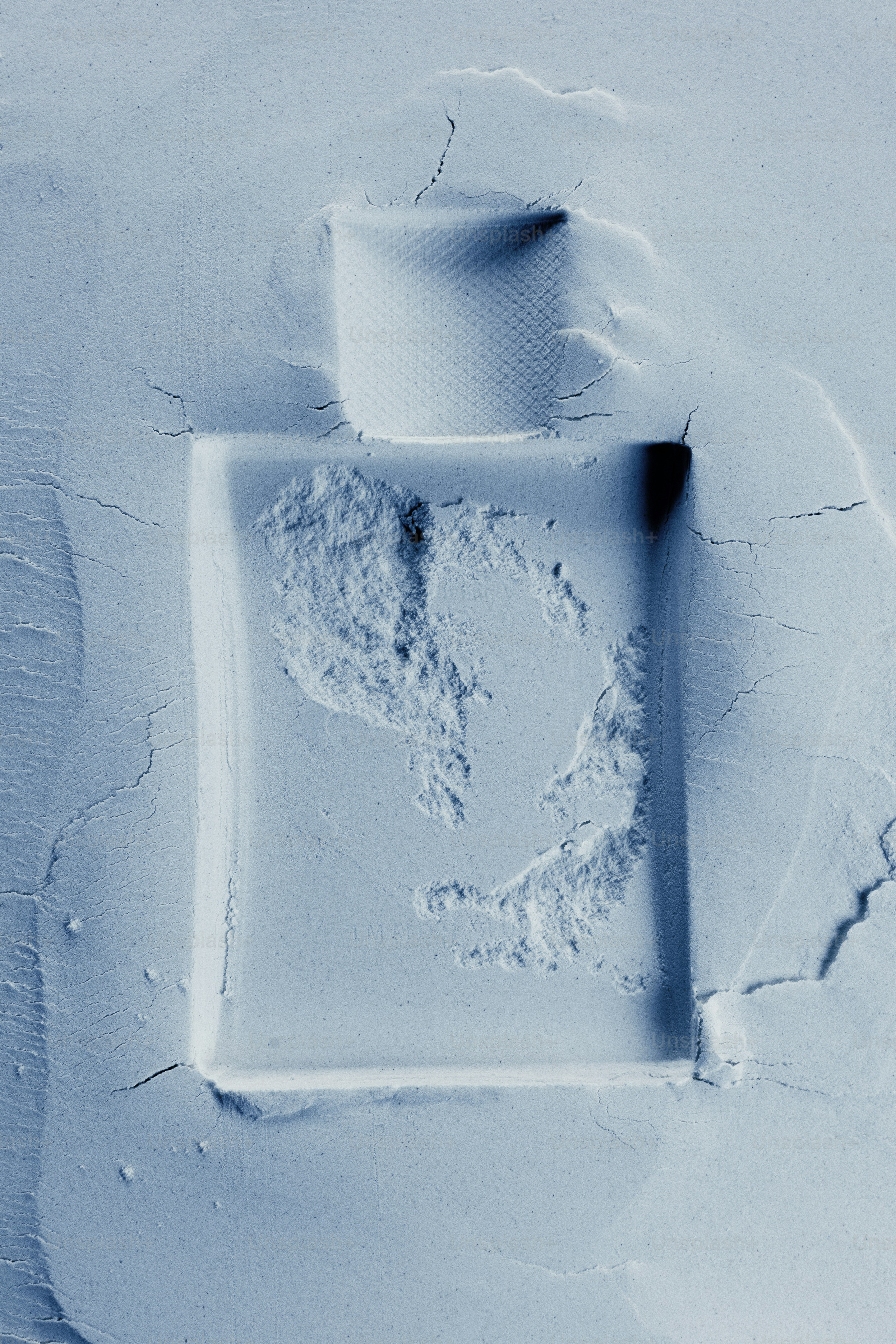 A bottle shape pressed into a powder photo – Skincare Image on Unsplash