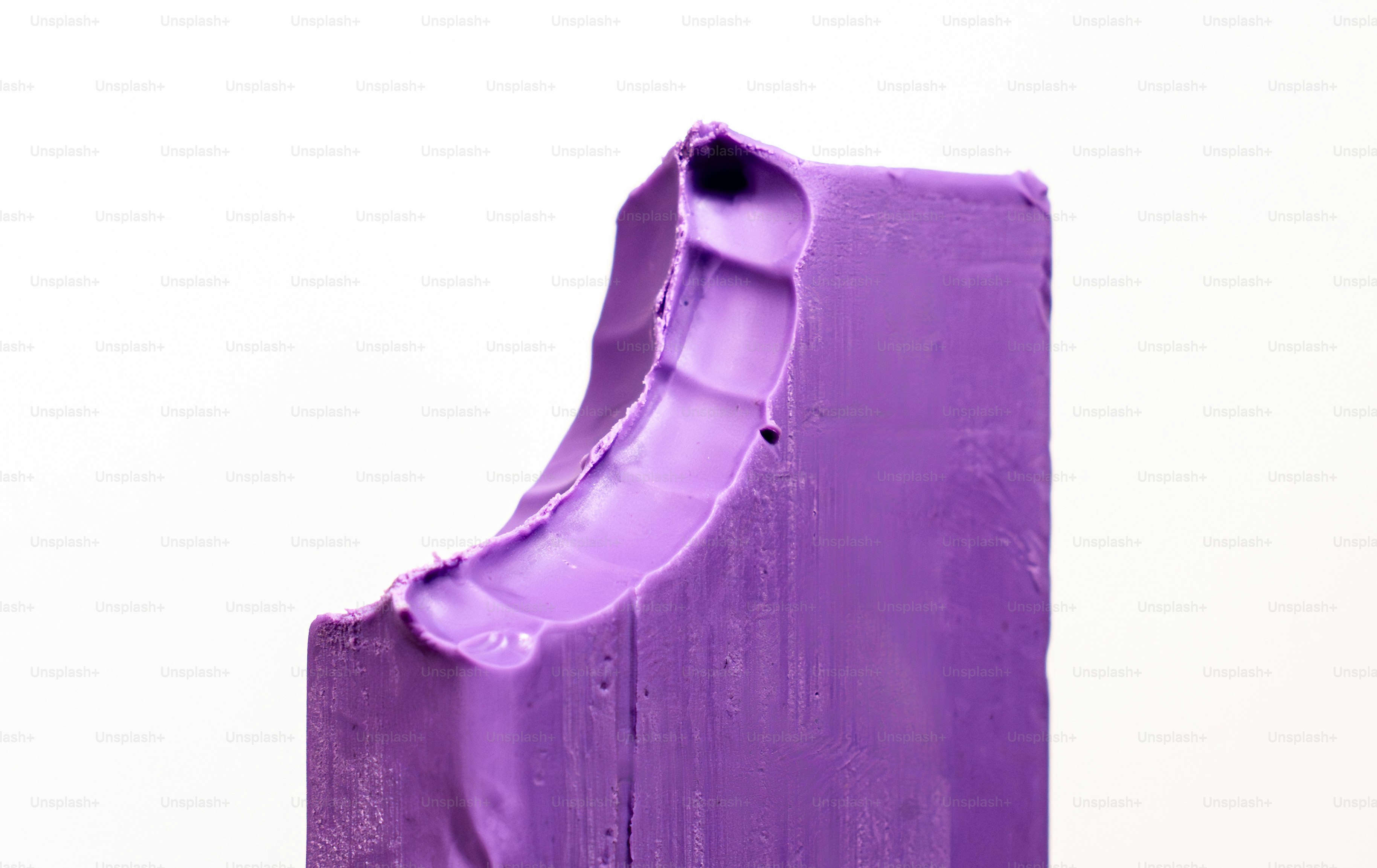 Purple clay sculpture with textured surface
