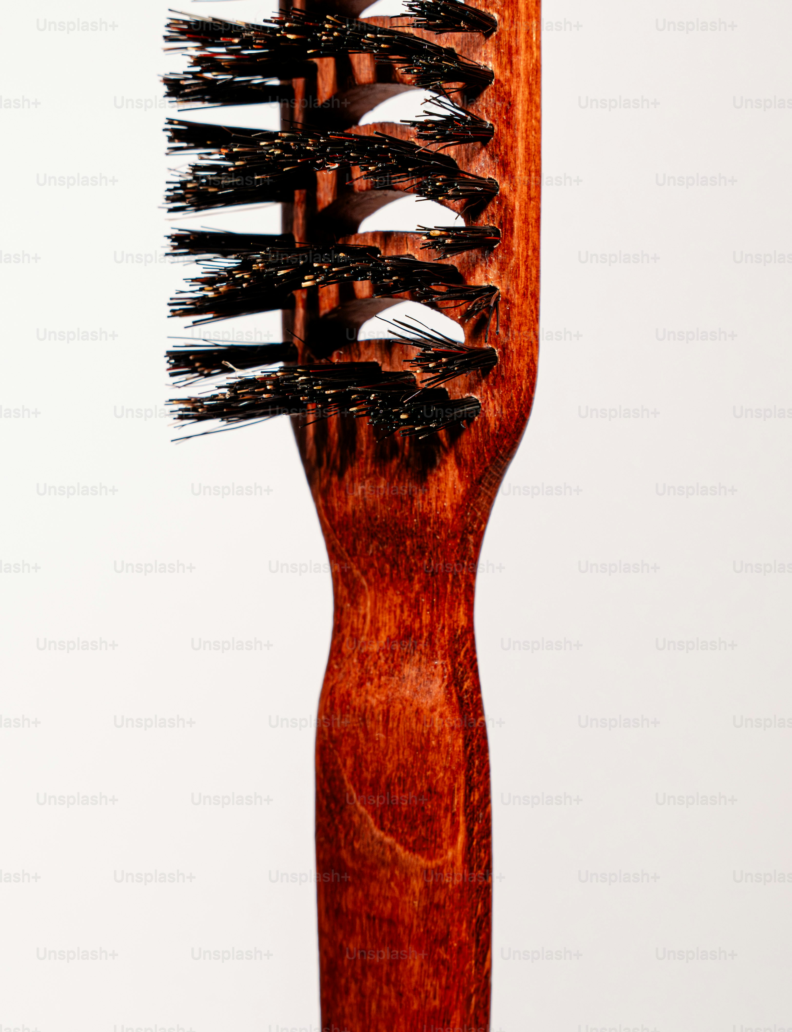 Close-up of a wooden hairbrush with bristles