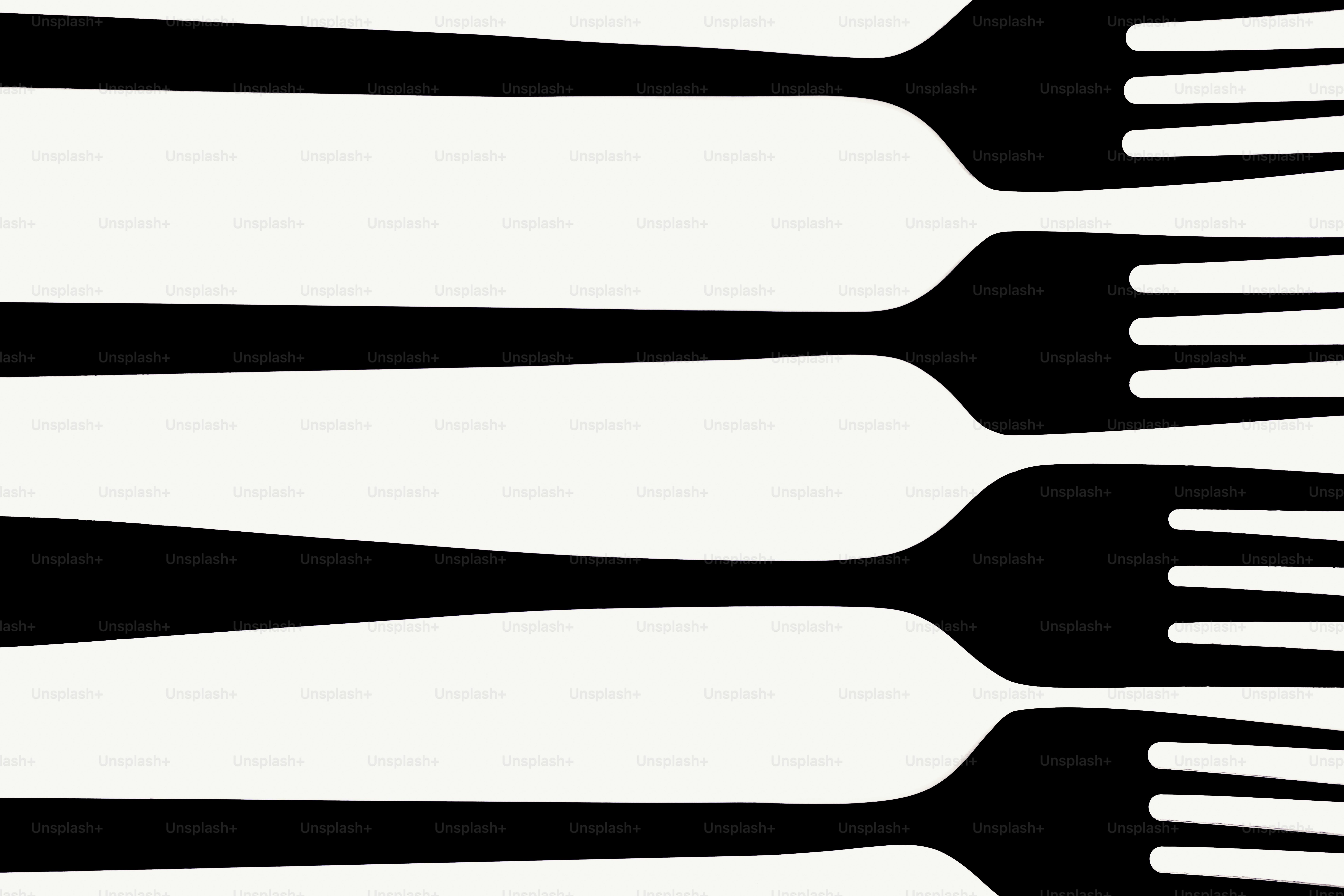 Row of black forks on a white background