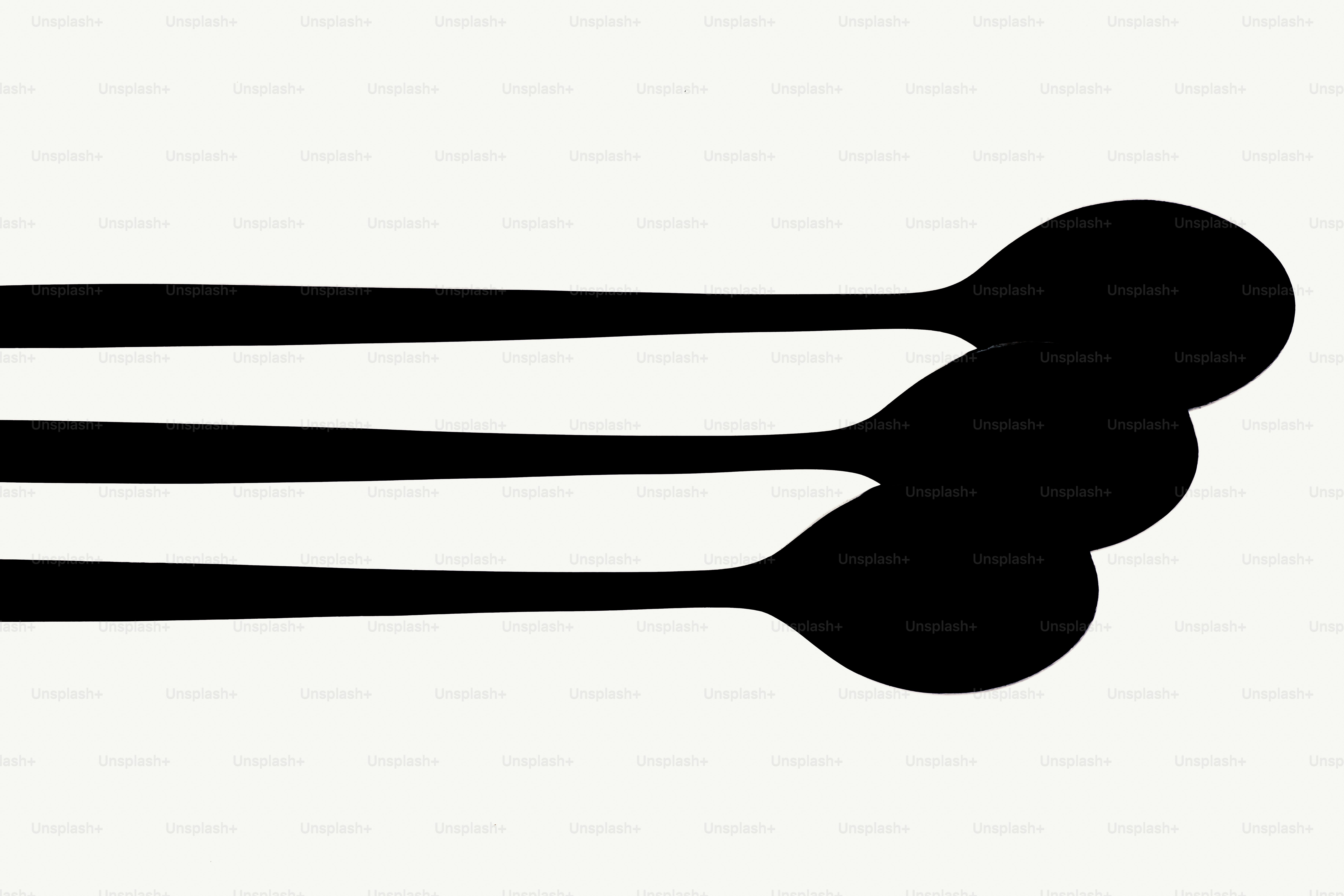 Three black abstract shapes on a white background