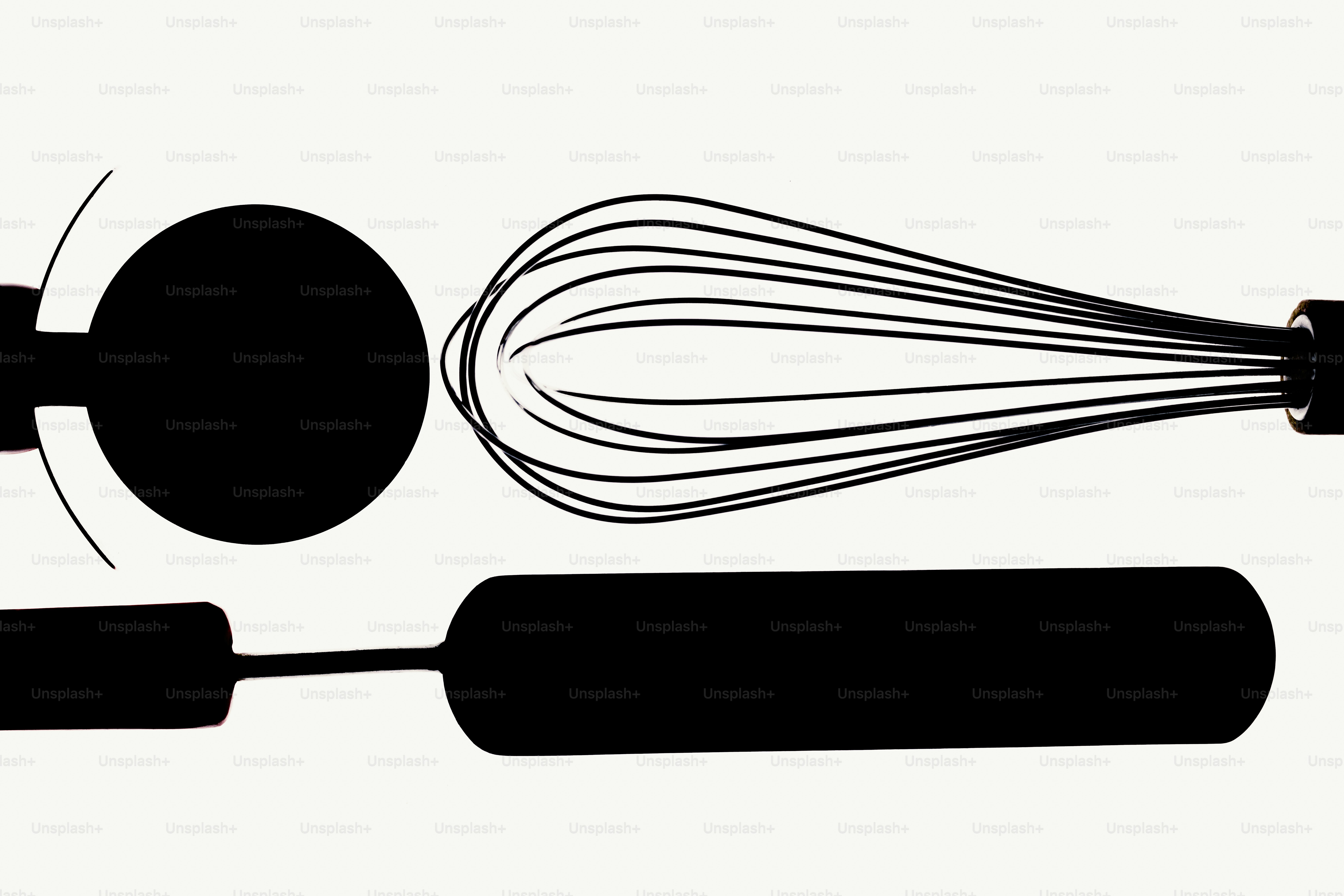 Black kitchen utensils on a white background