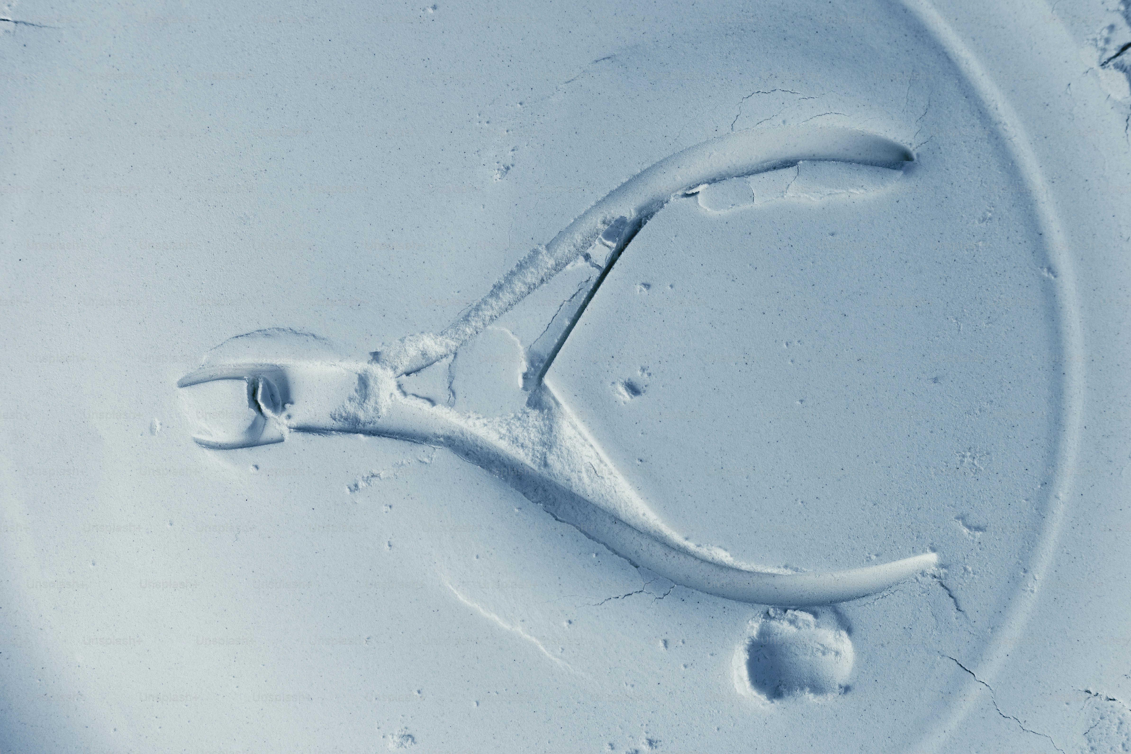 Close up of wire cutters in a circular mold