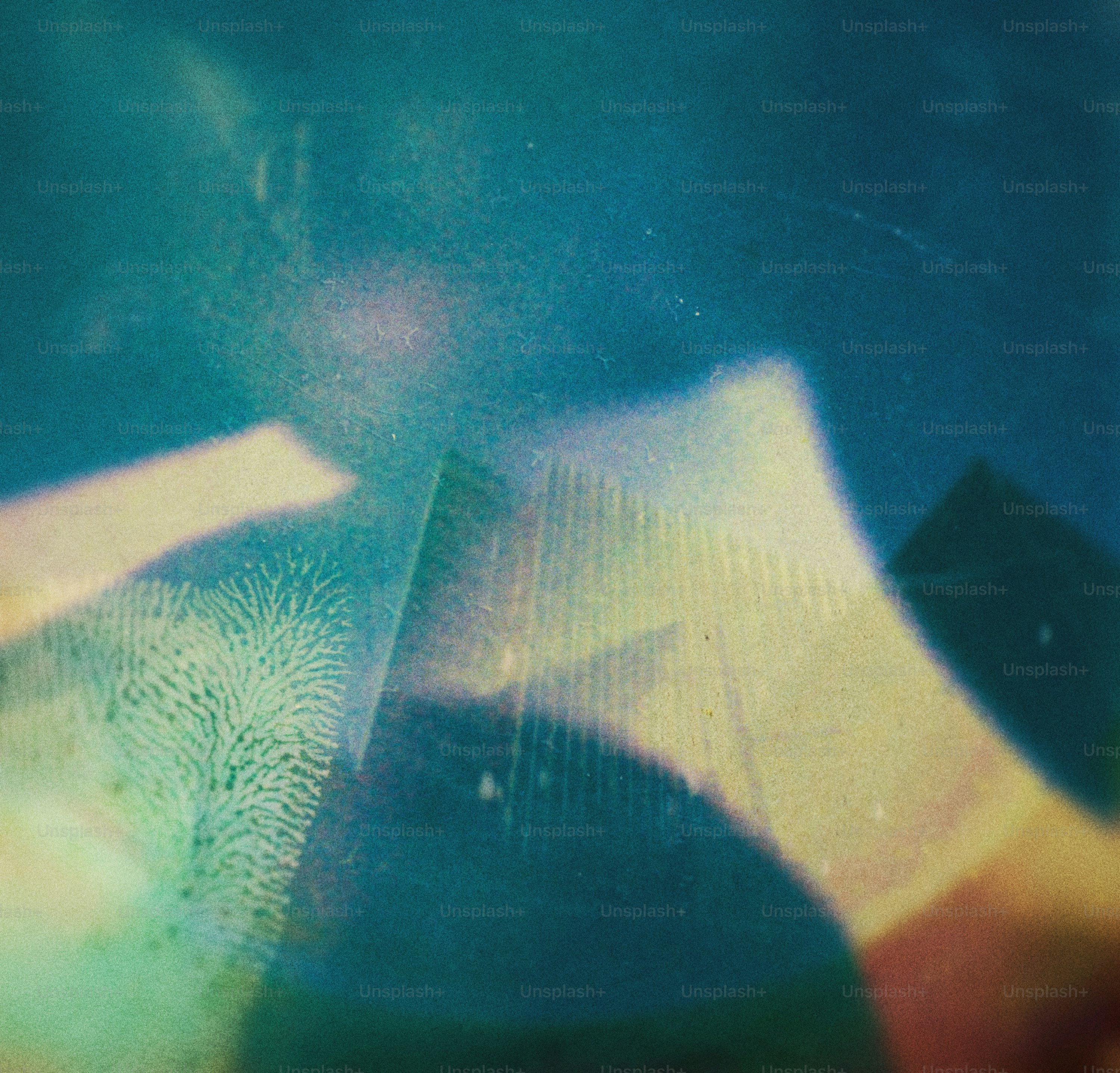 Abstract blue and white shapes with textured overlay