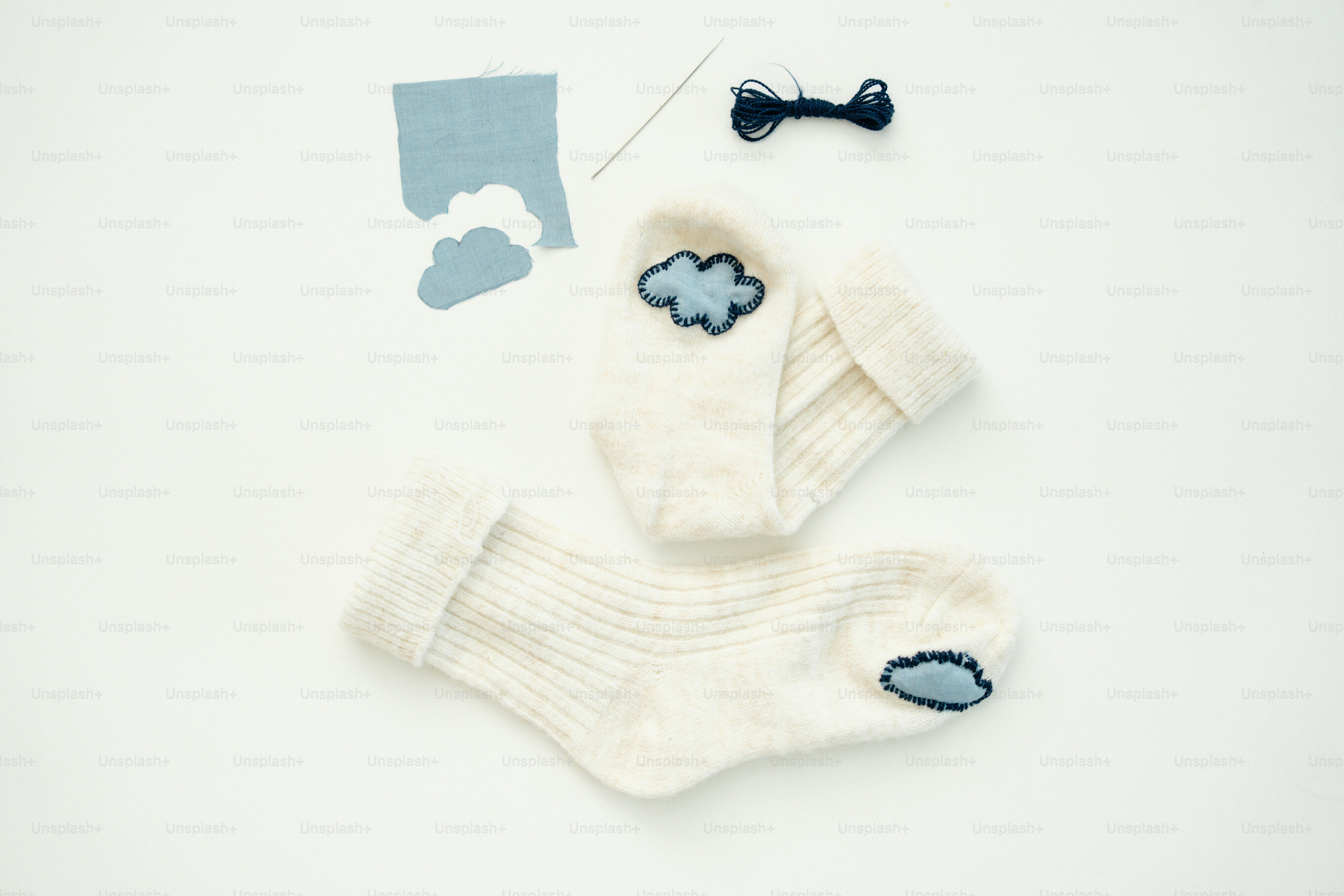 White socks with blue cloud appliques and bow tie