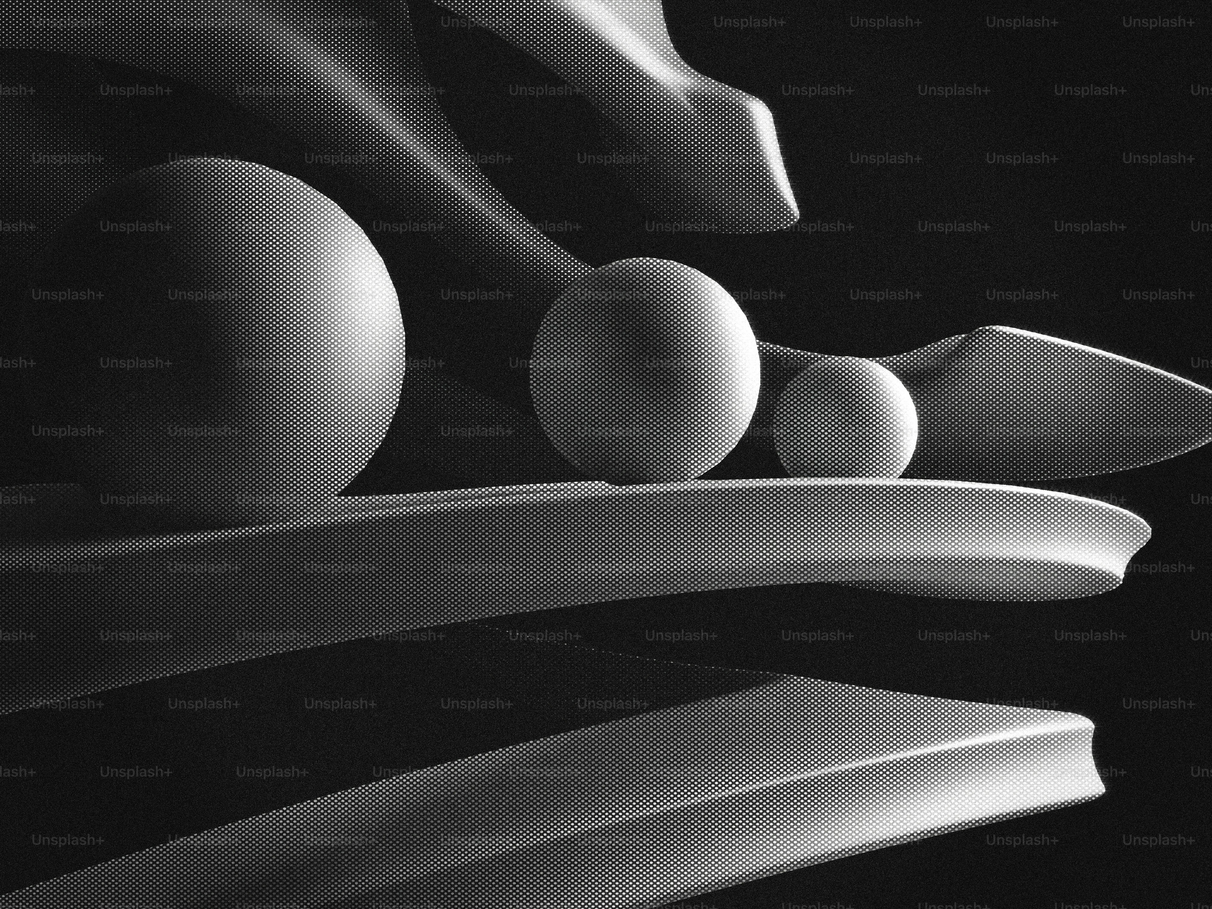 Three spheres balanced on a spiral structure photo – Abstract Image on ...