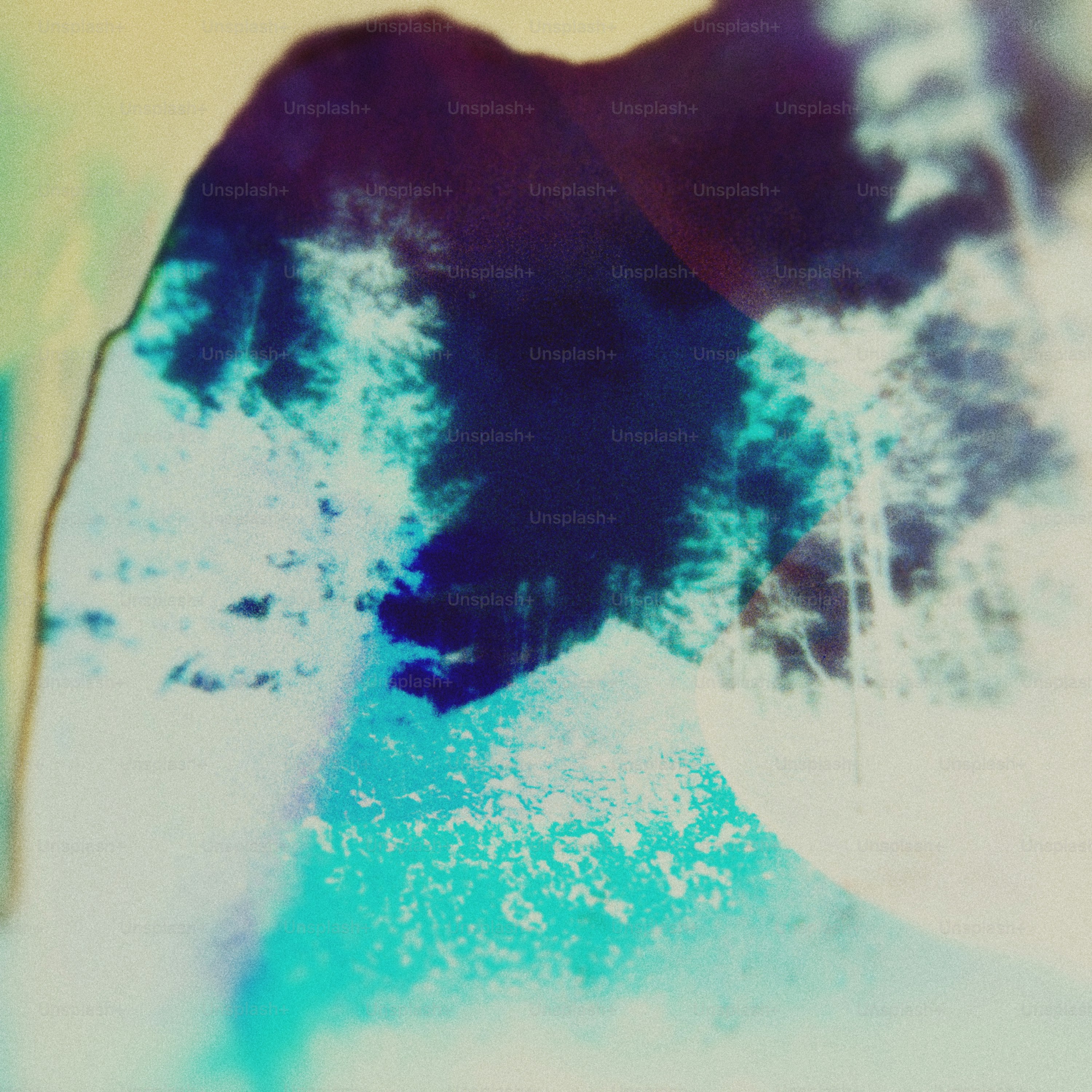 Abstract dark blue and teal shapes with bright white highlights