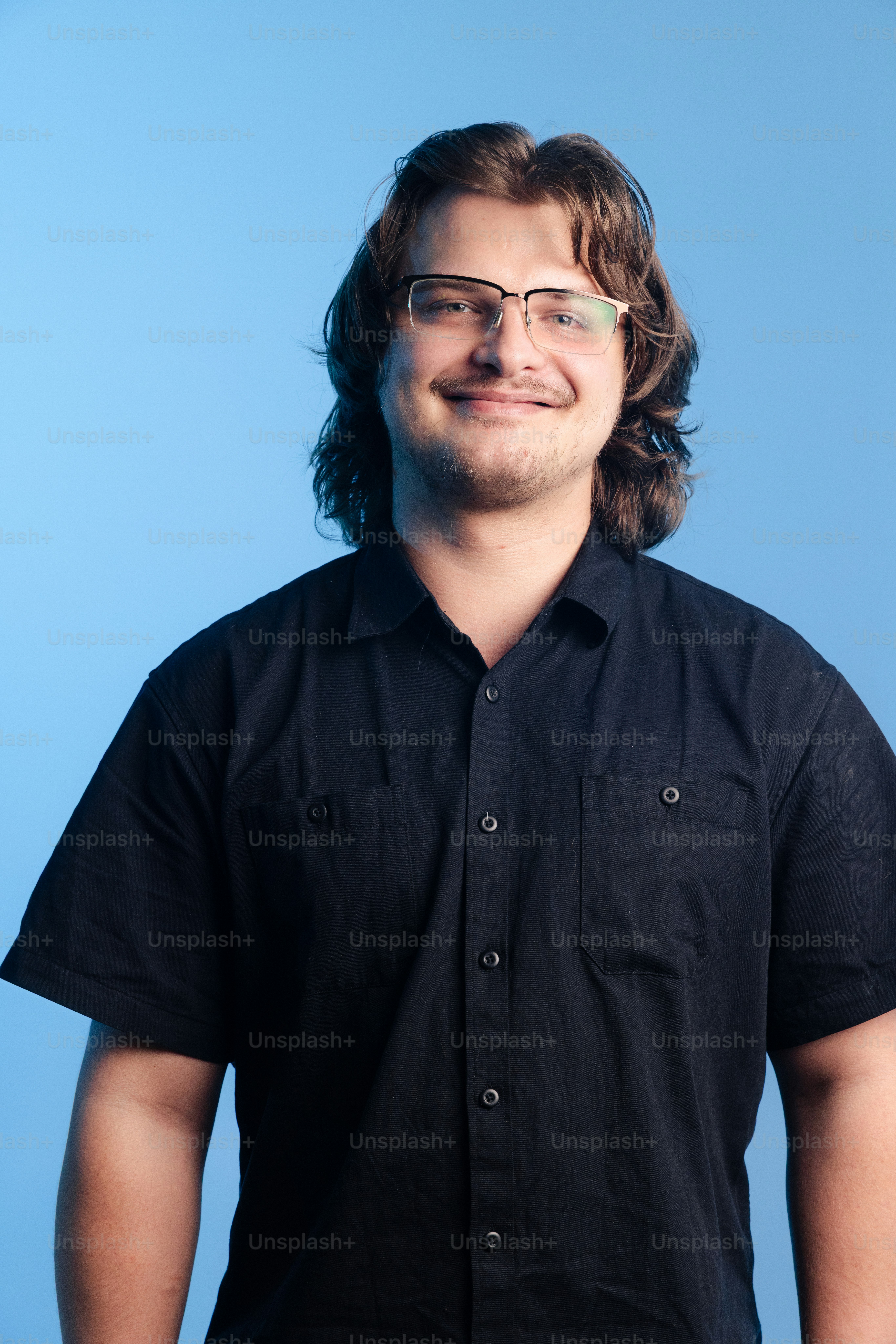 A young man with glasses and dark shirt photo – Portrait Image on Unsplash