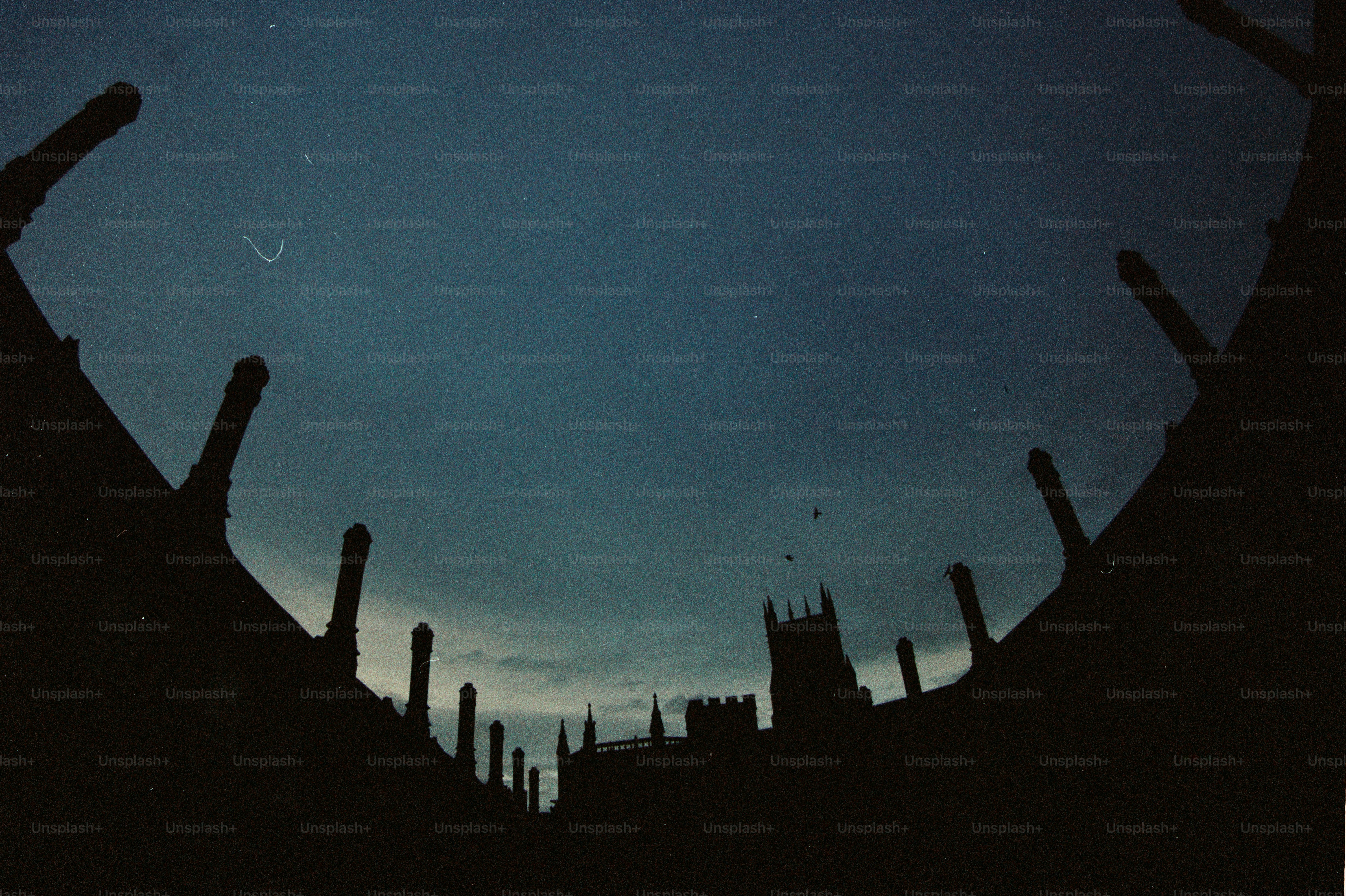 Gothic architecture silhouetted against a twilight sky. photo ...