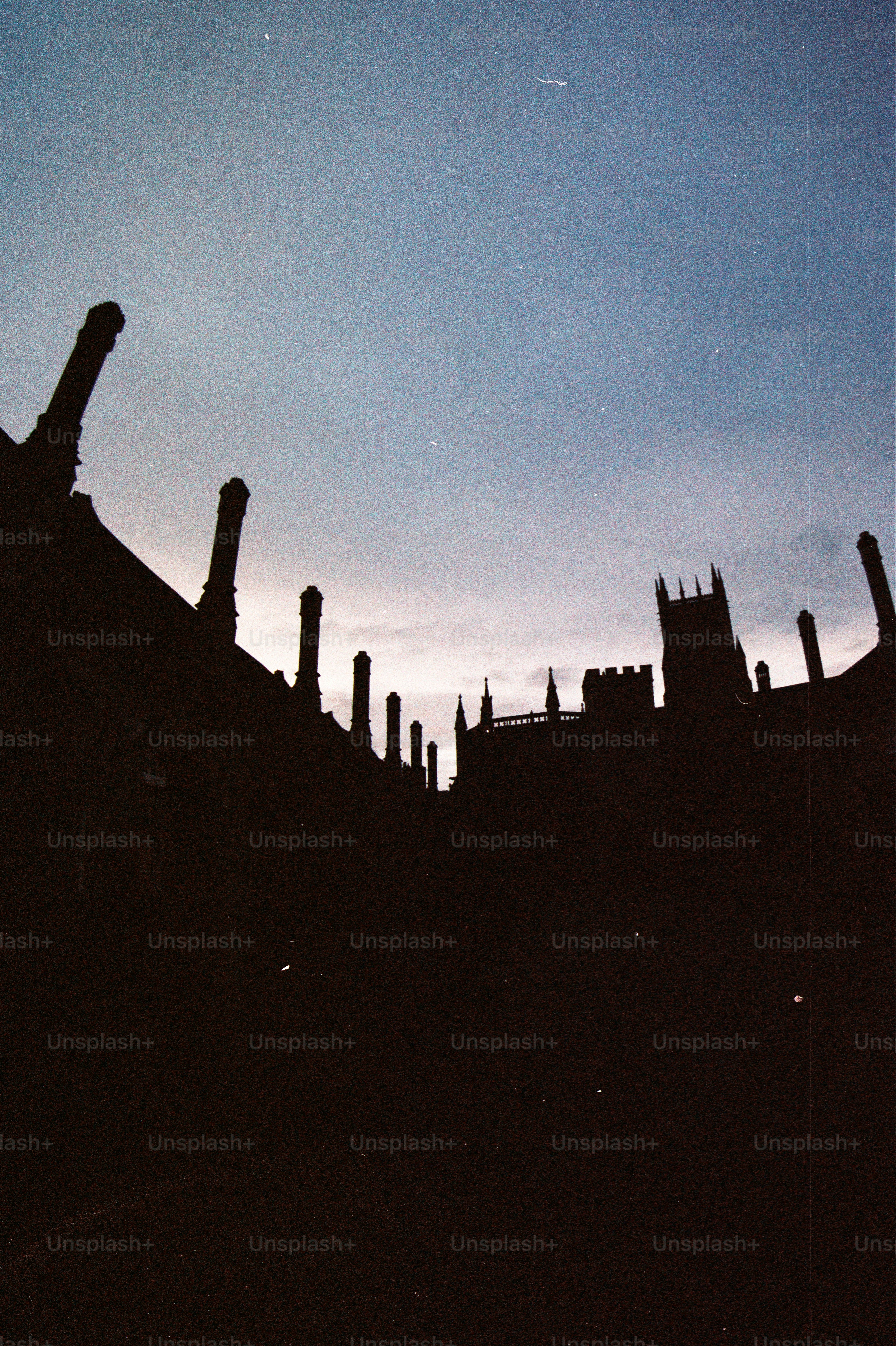 Gothic architecture silhouetted against a twilight sky. photo ...