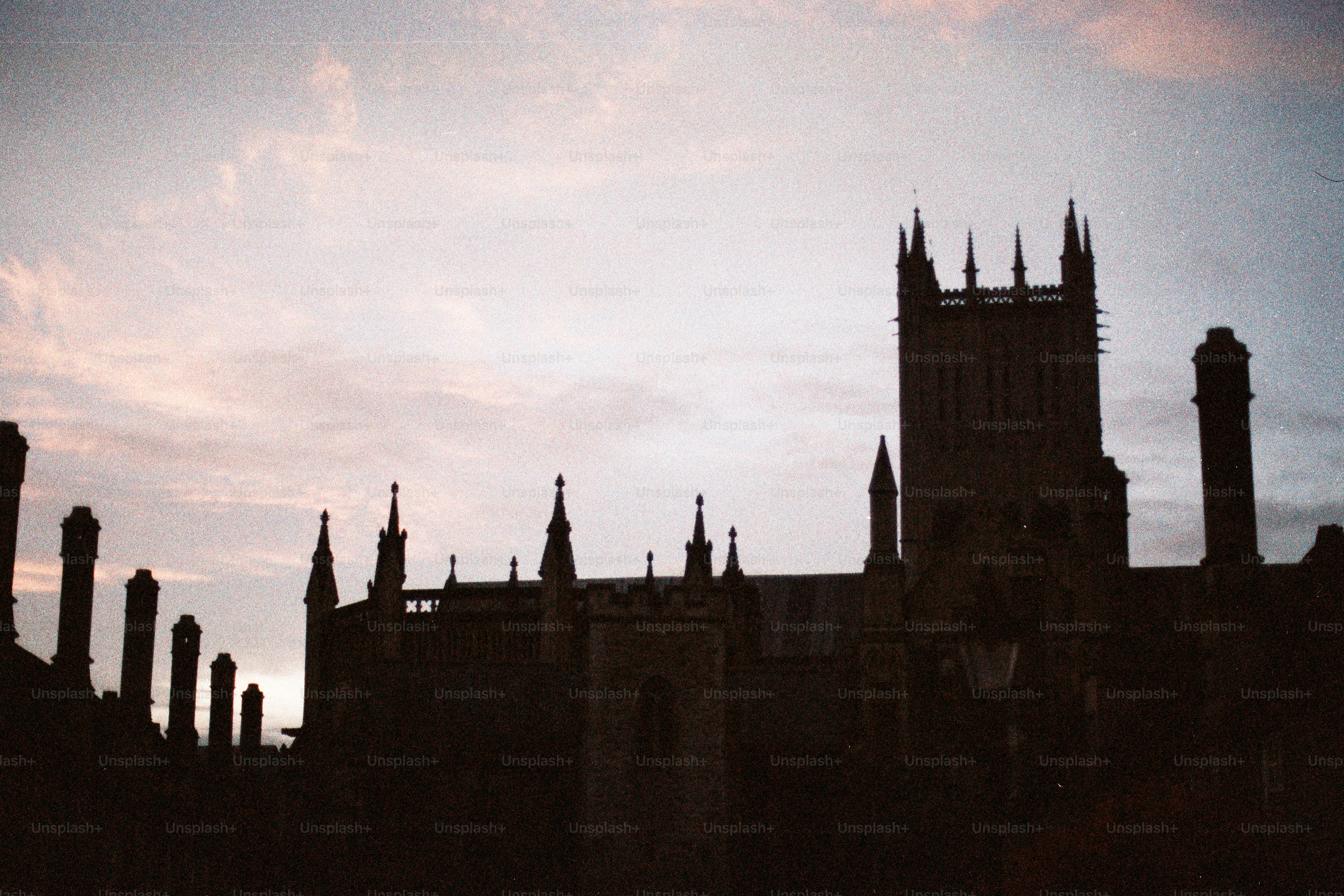 Gothic architecture silhouetted against a twilight sky. photo ...
