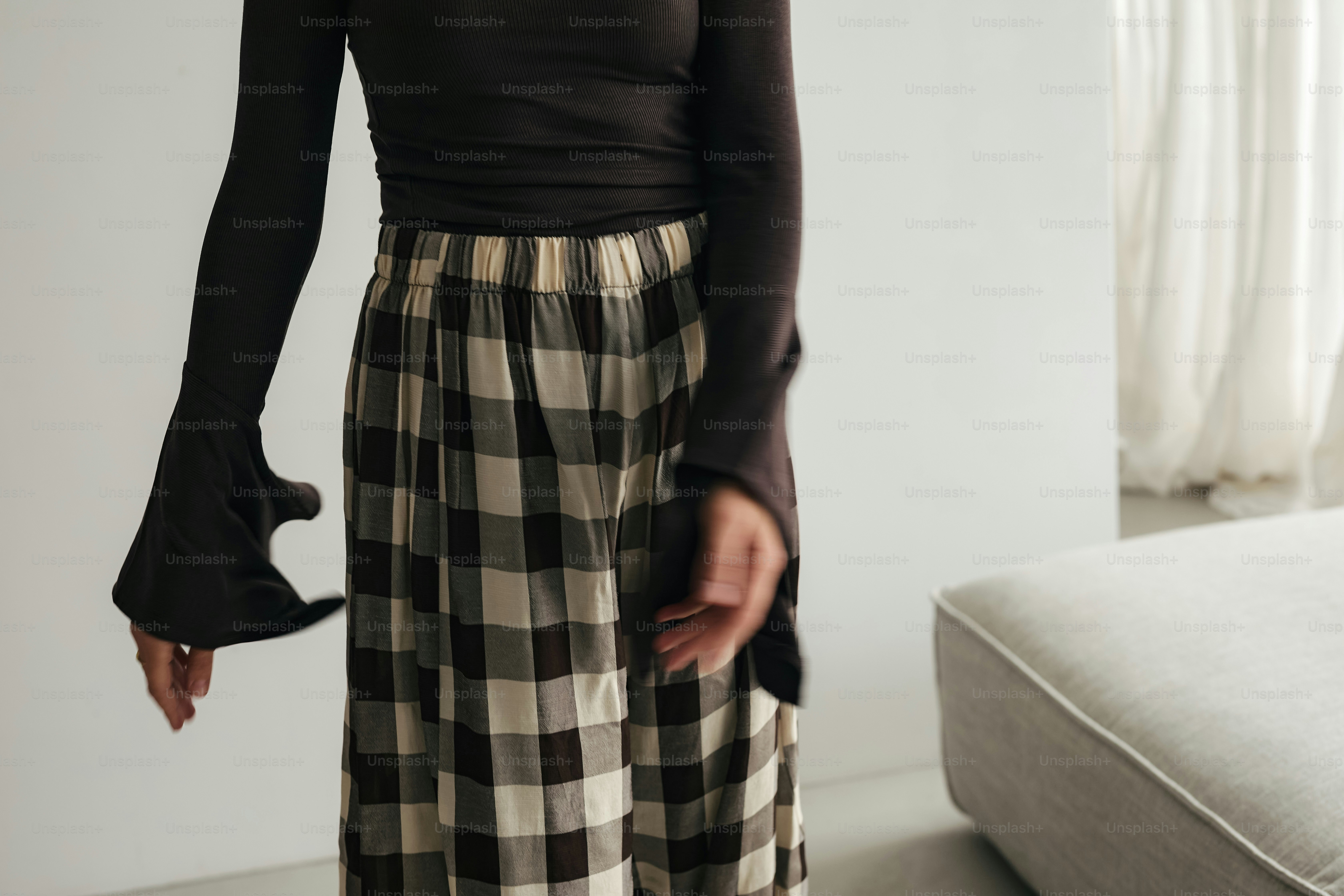 Woman wearing a black top and plaid skirt photo – Patterns Image on ...