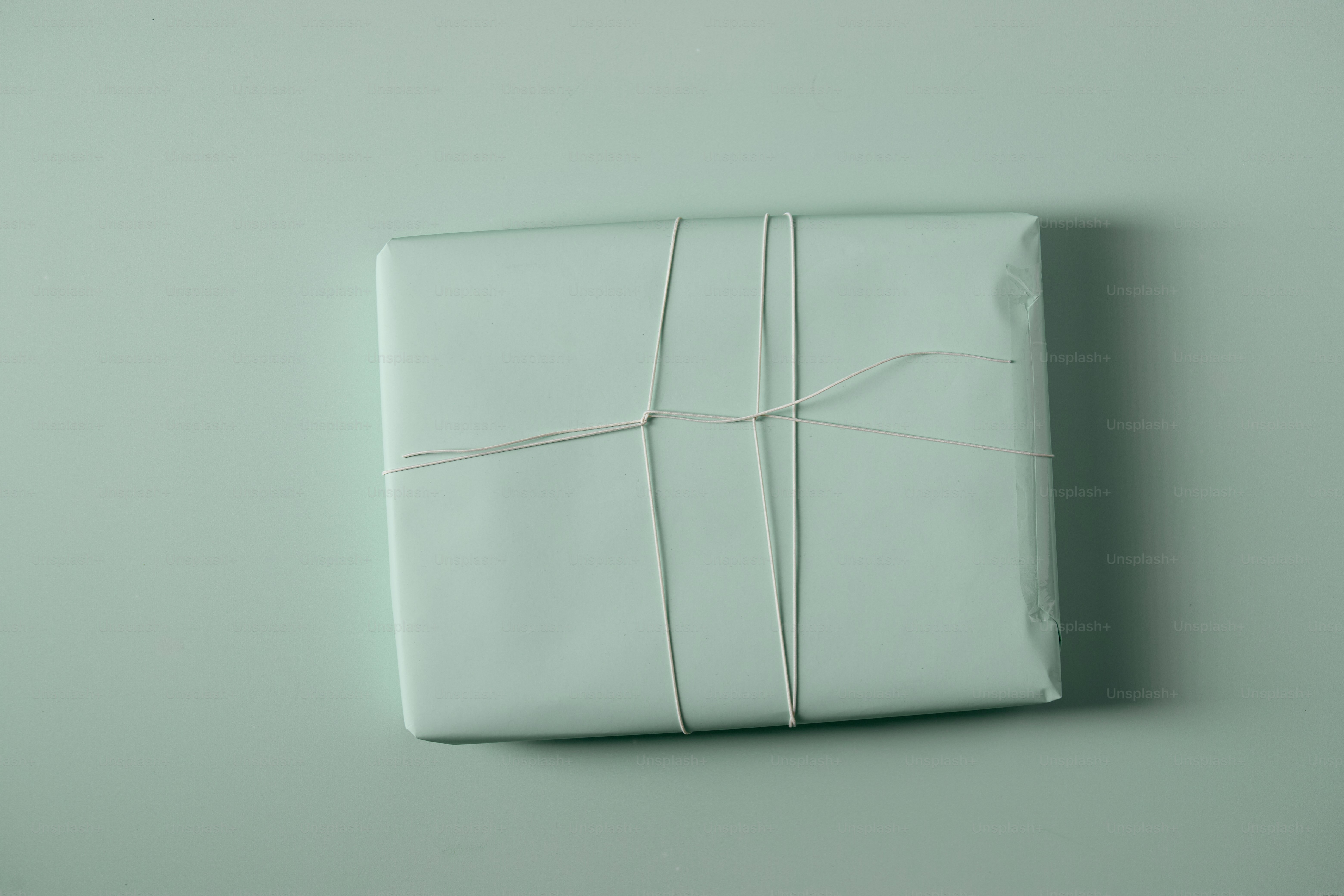 A white gift box wrapped with string