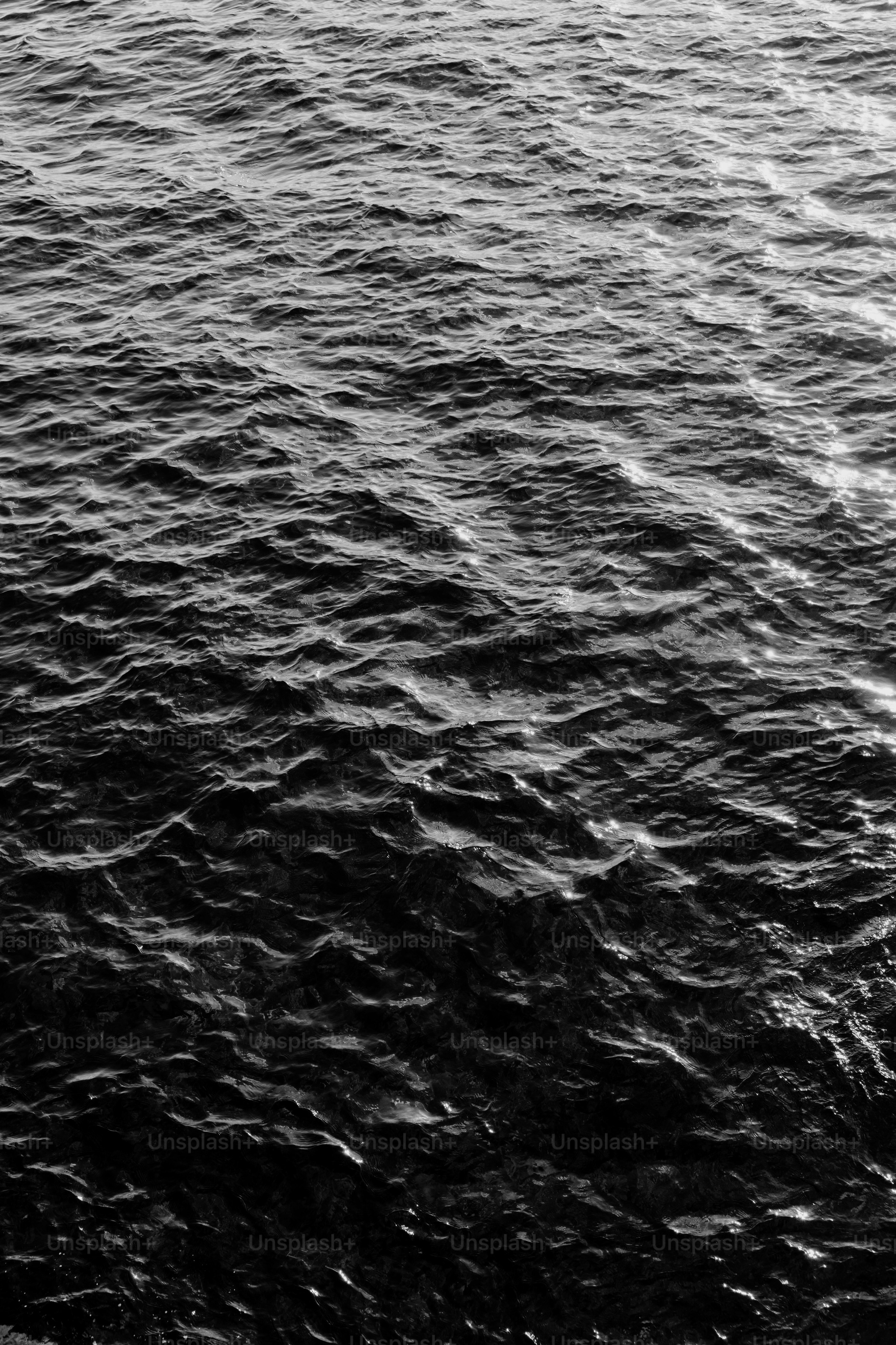 Dark, rippling ocean water in black and white photo – Wallpaper Image ...
