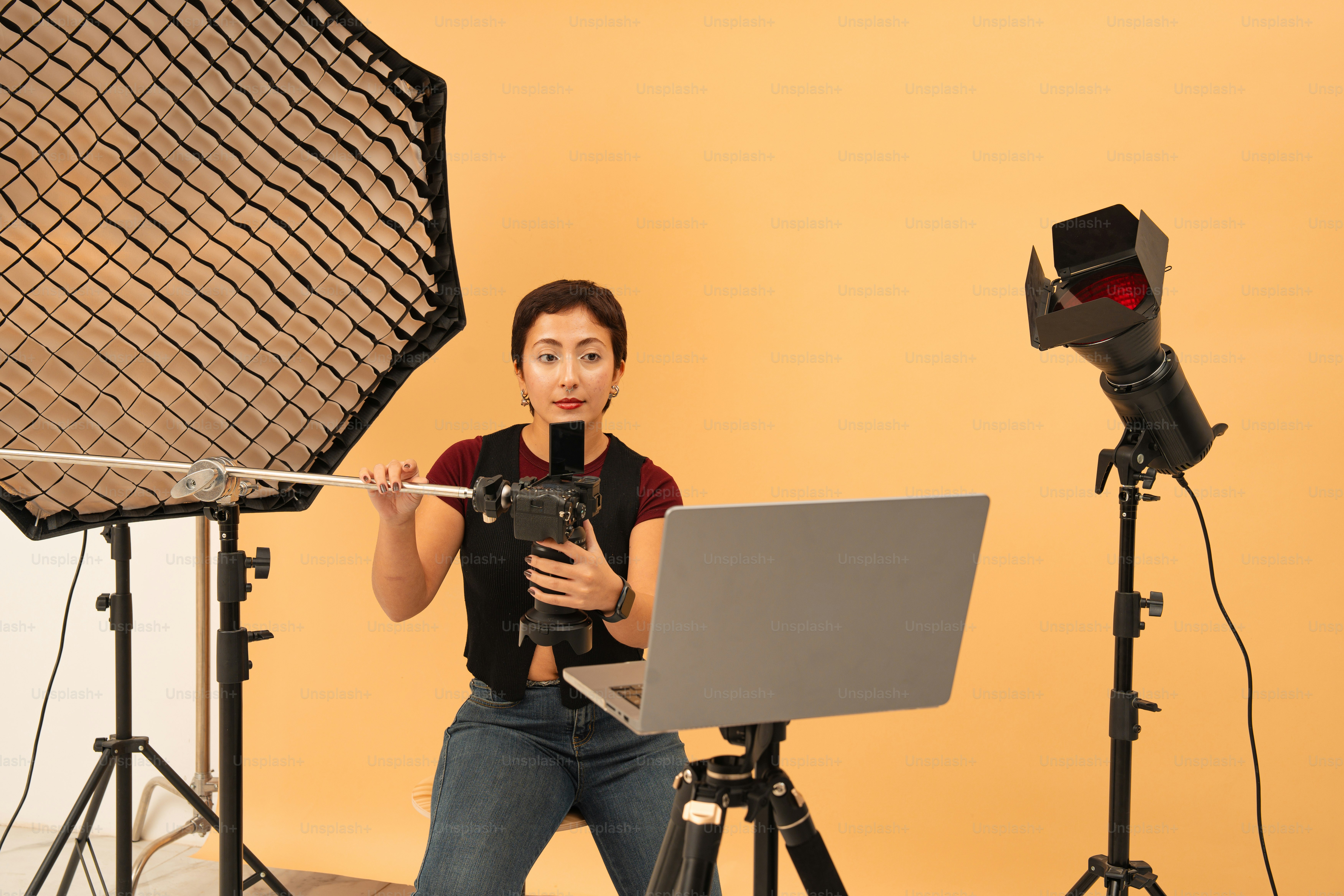 Woman recording video with camera and laptop. photo – Artificial ...