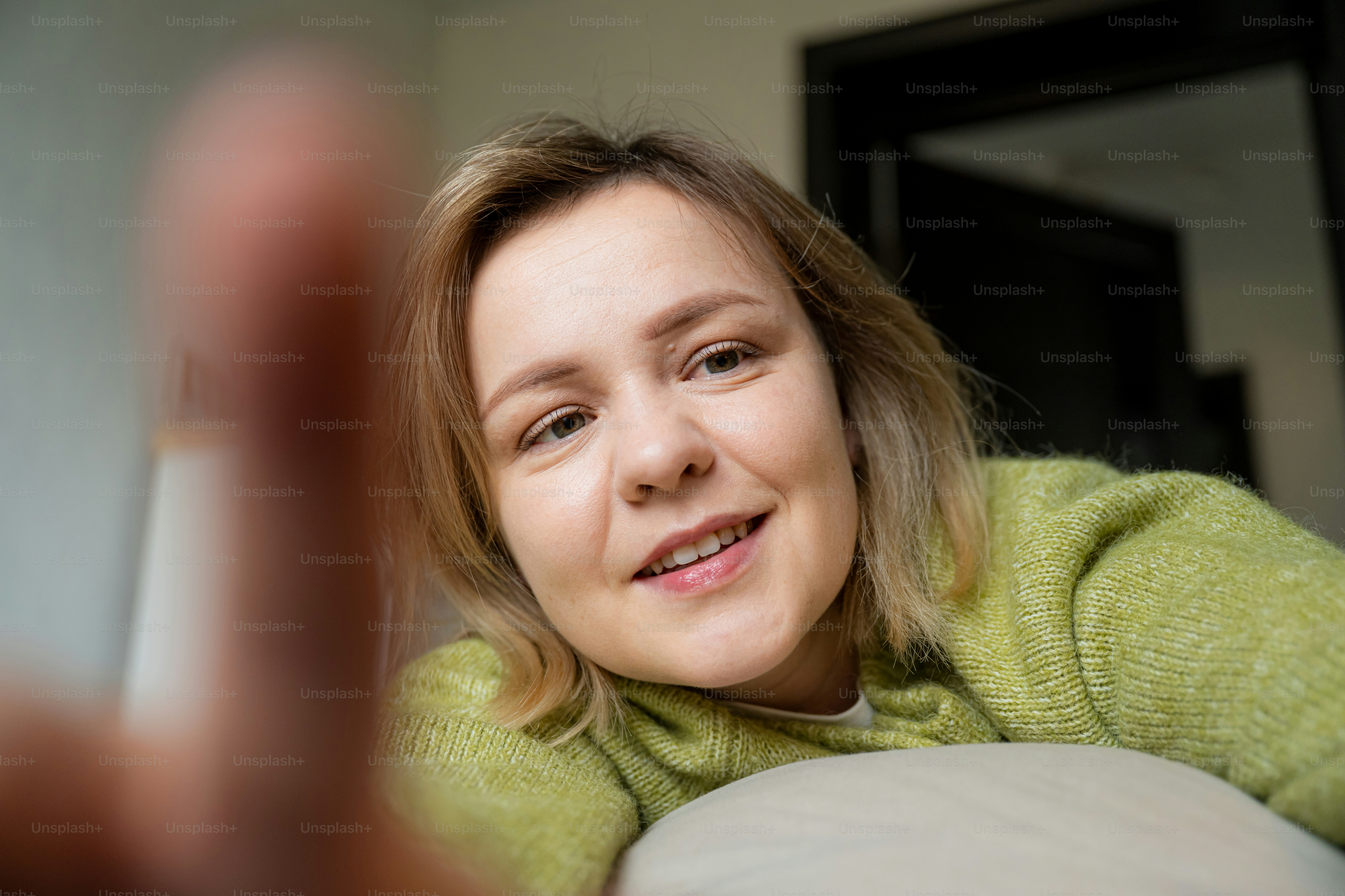 Young woman smiling and looking at the camera