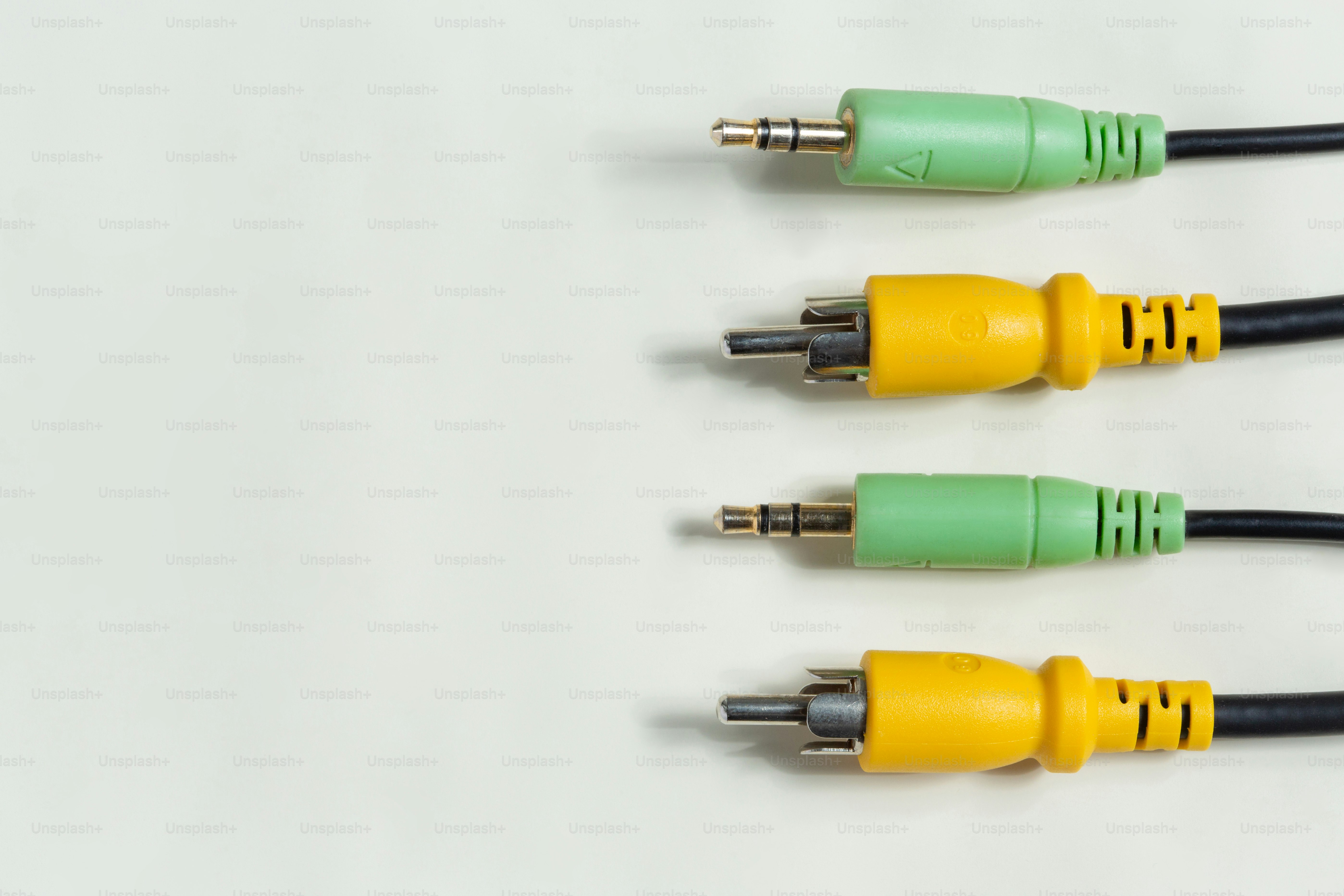 Four audio cables with green and yellow connectors. photo – Technology ...