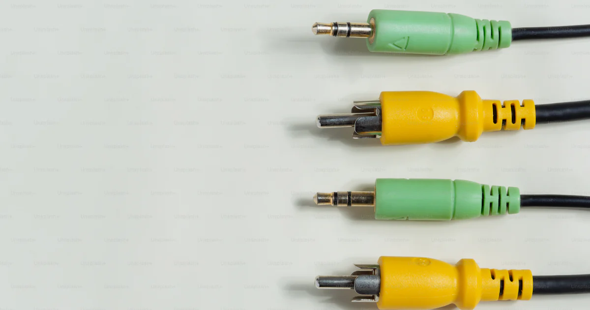 Four audio cables with green and yellow connectors. photo – Technology ...