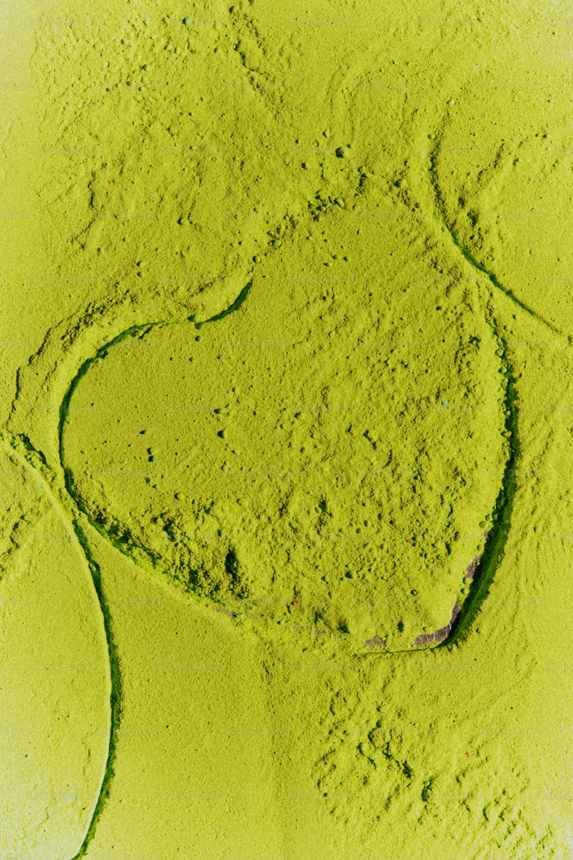 Textured lime green surface with circular patterns photo – Background ...