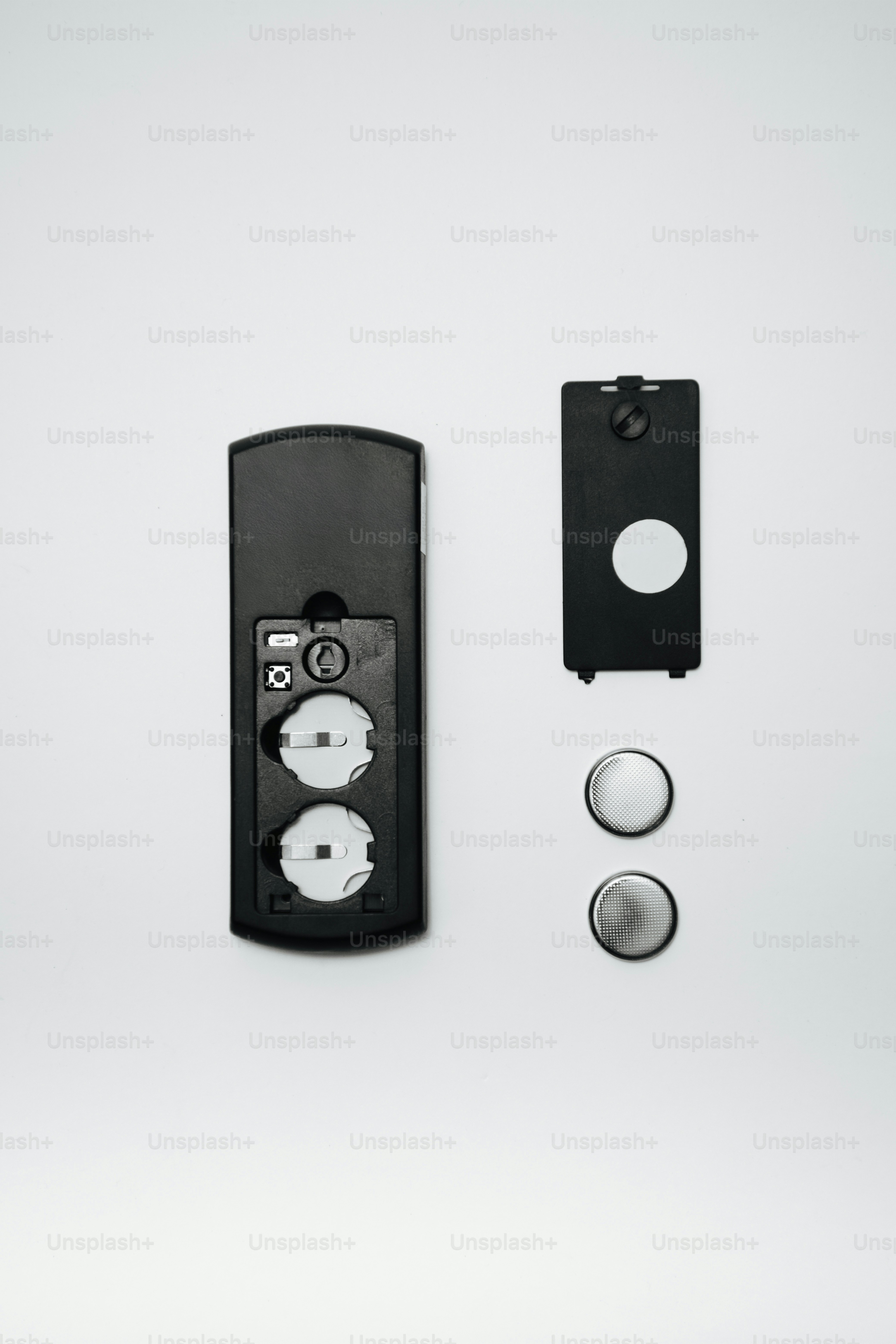 Remote control with batteries and cover disassembled