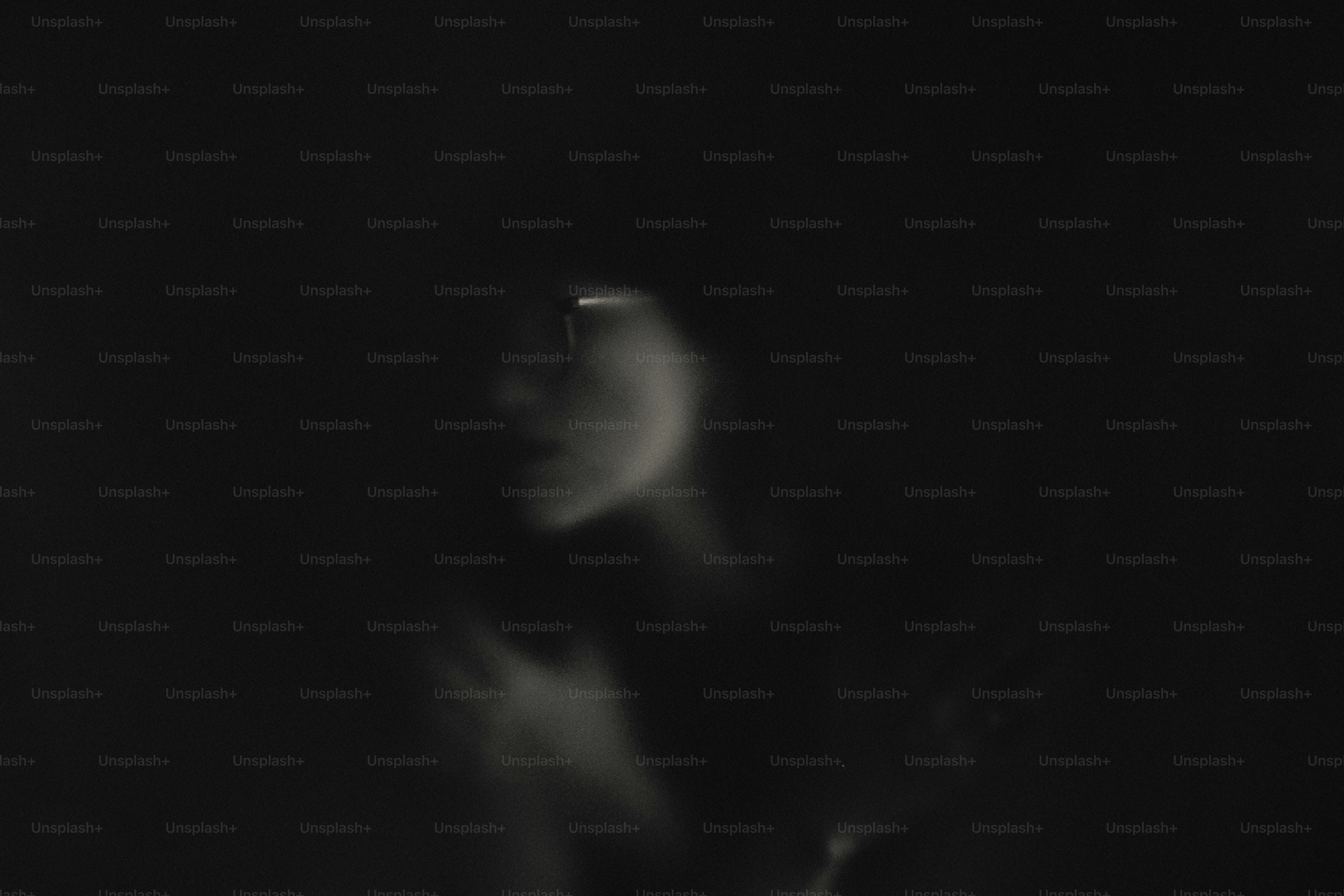 A shadowy profile of a woman's face photo – Portrait Image on Unsplash